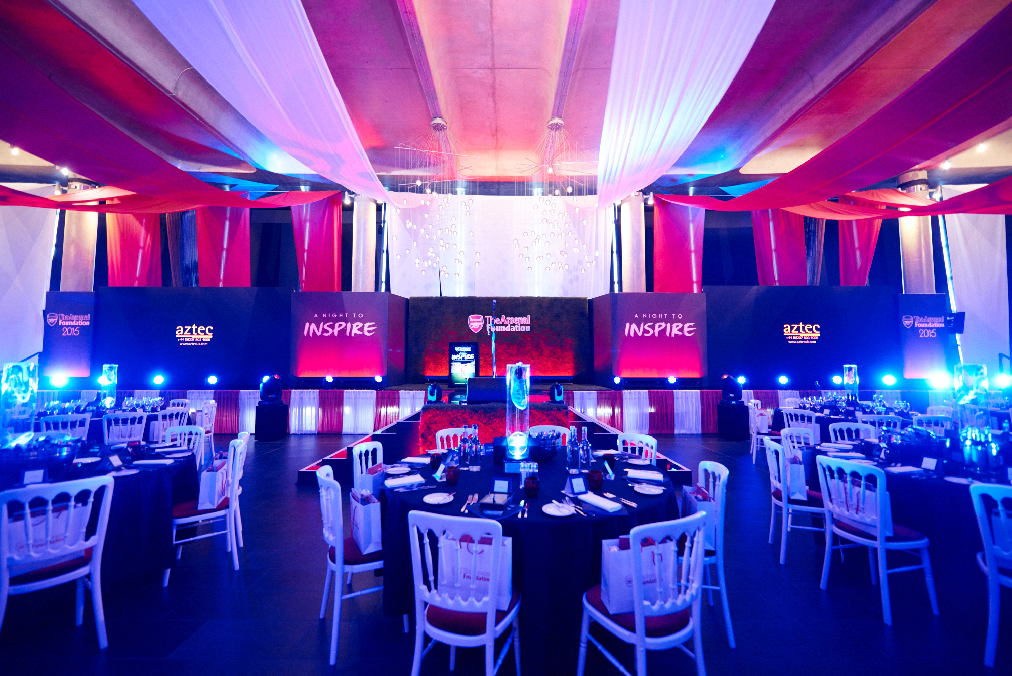 "Emirates Stadium event space with elegant tables, ideal for formal gatherings and presentations."