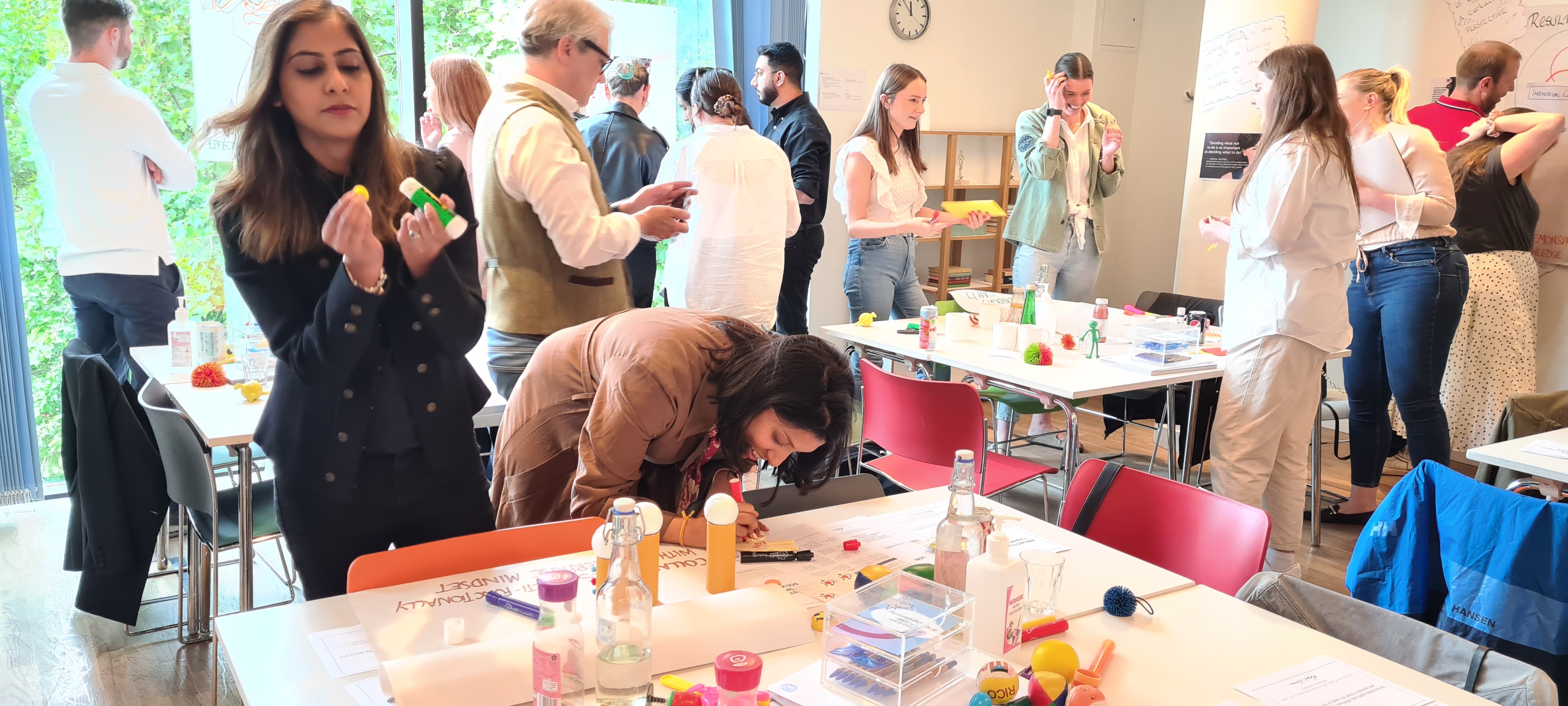 Dynamic workshop at Silk + Cotton with colorful materials for creative brainstorming.