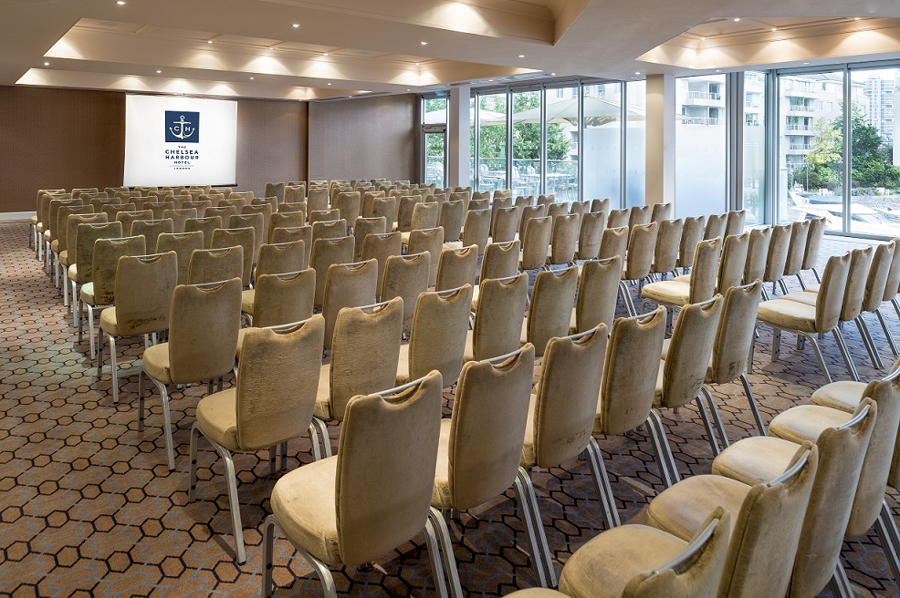 Drakes Suite at Chelsea Harbour Hotel, beige chairs arranged for presentations and workshops.