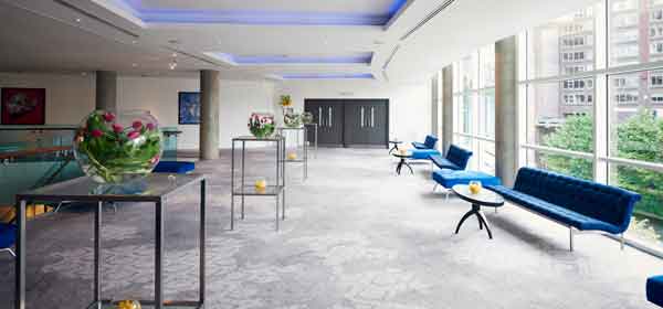 Modern event space with natural light for corporate meetings and social gatherings.