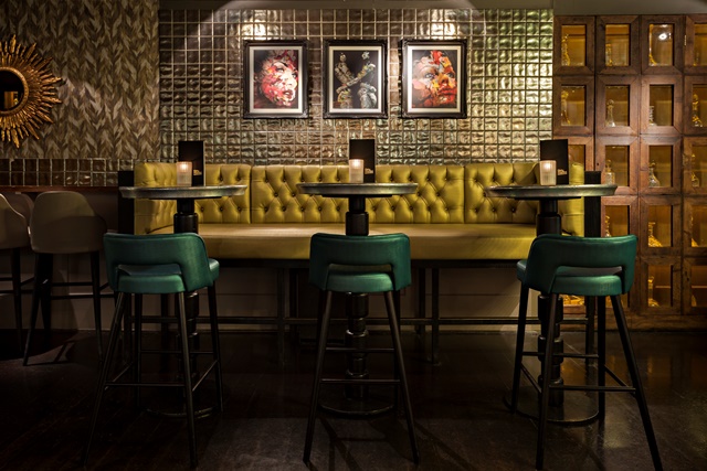 Stylish event space at Dirty Martini Bishopsgate with vibrant yellow banquette for cocktail receptions.