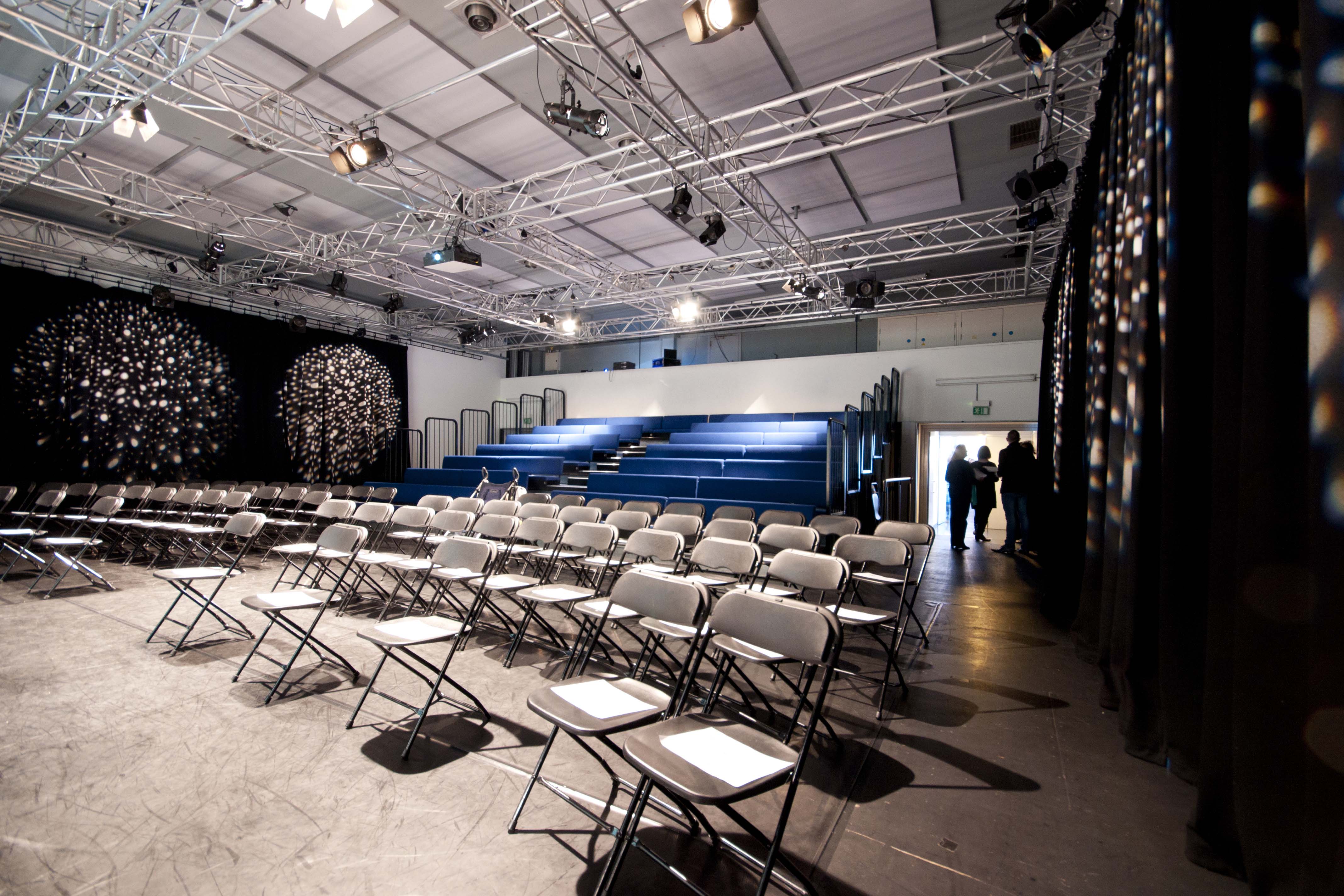 Event space at The Studio in Rich Mix with folding chairs, ideal for presentations and performances.