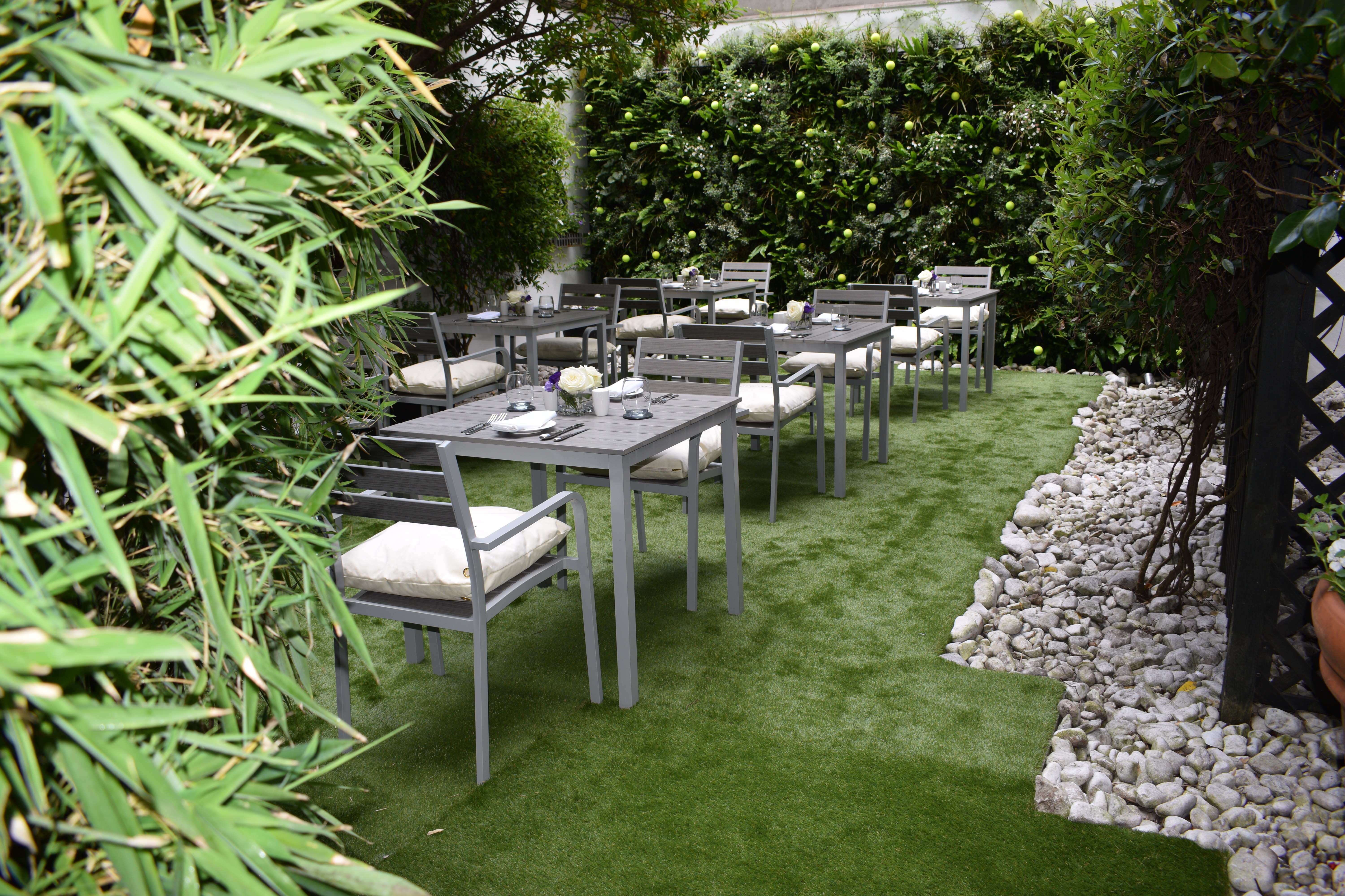 Hyde Garden at Roseate House London, lush lawn for outdoor events and gatherings.