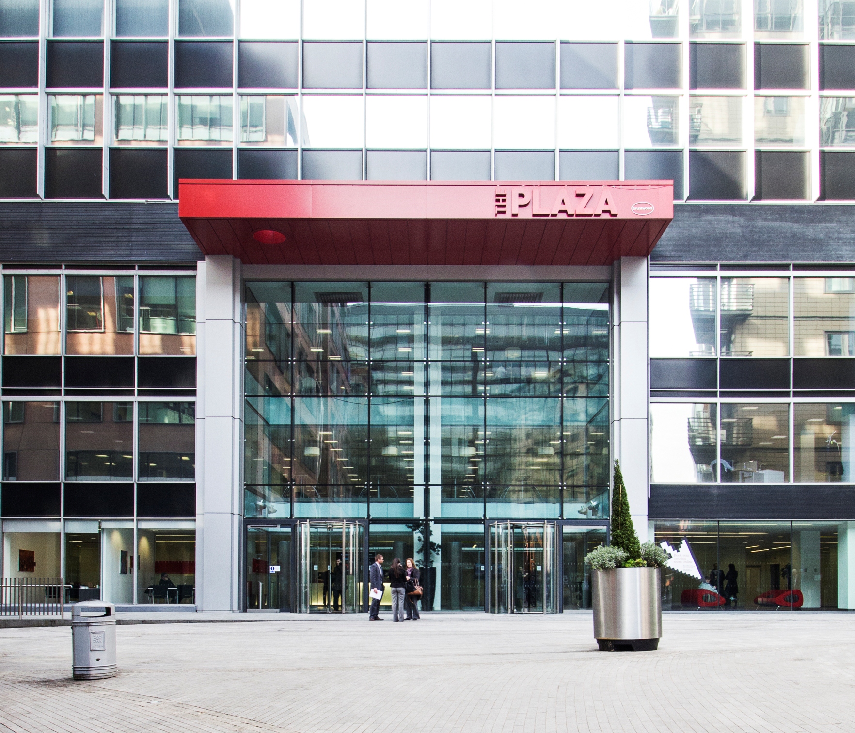 Modern glass entrance of The Red Rooms at The Plaza, perfect for corporate events.