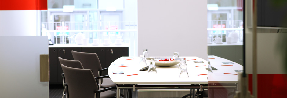 Modern meeting space in The Plaza with oval table, ideal for brainstorming sessions.