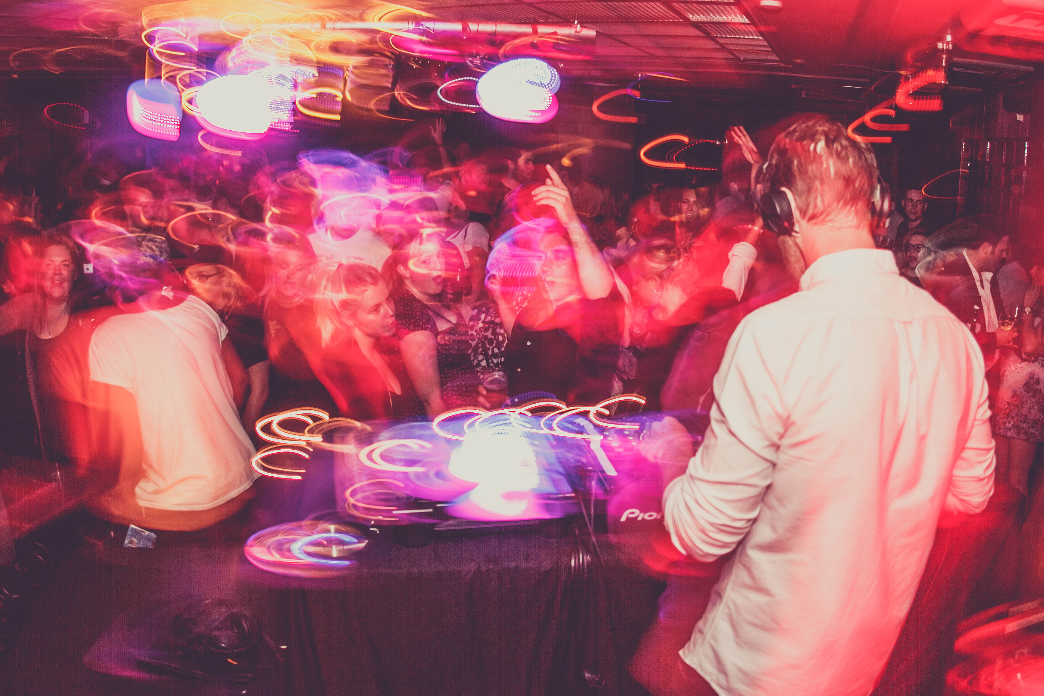 Vibrant DJ performance at The Basement, Cavendish Square, with dynamic lighting and dancing crowd.