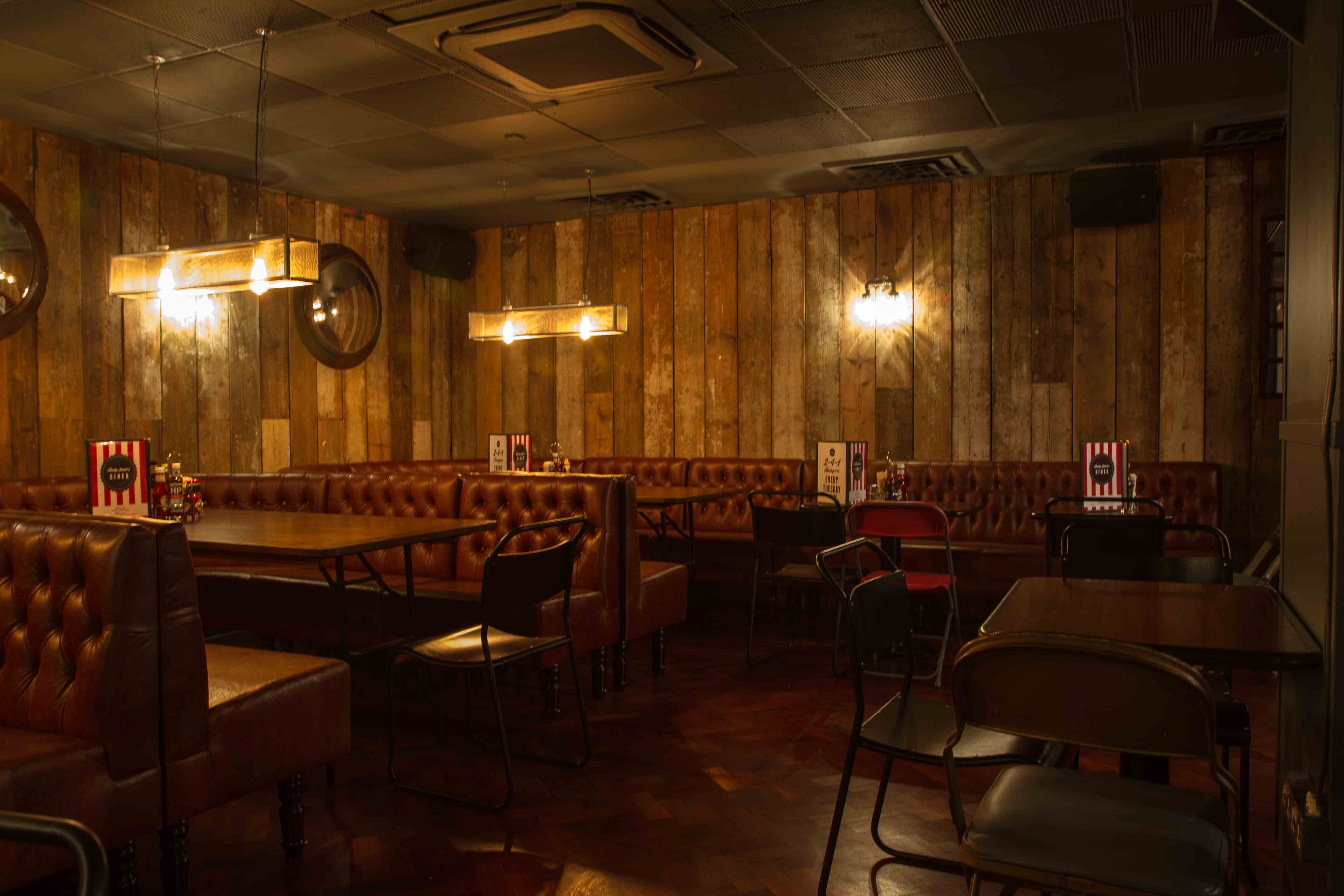 Cozy venue with warm wood paneling for private events and gatherings in Cavendish Square.