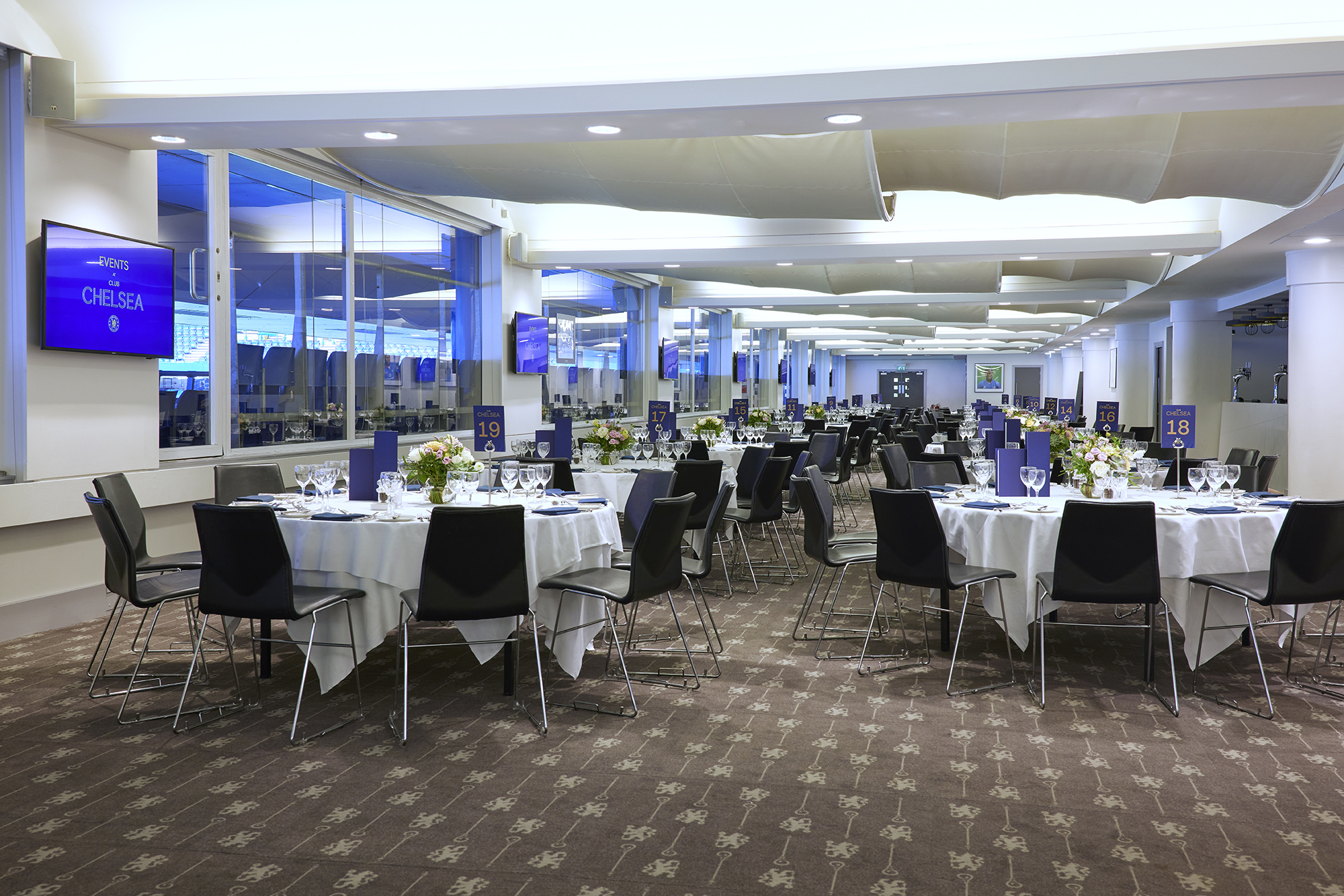 Canoville Suite at Chelsea FC, elegant dinner setup for corporate events and celebrations.