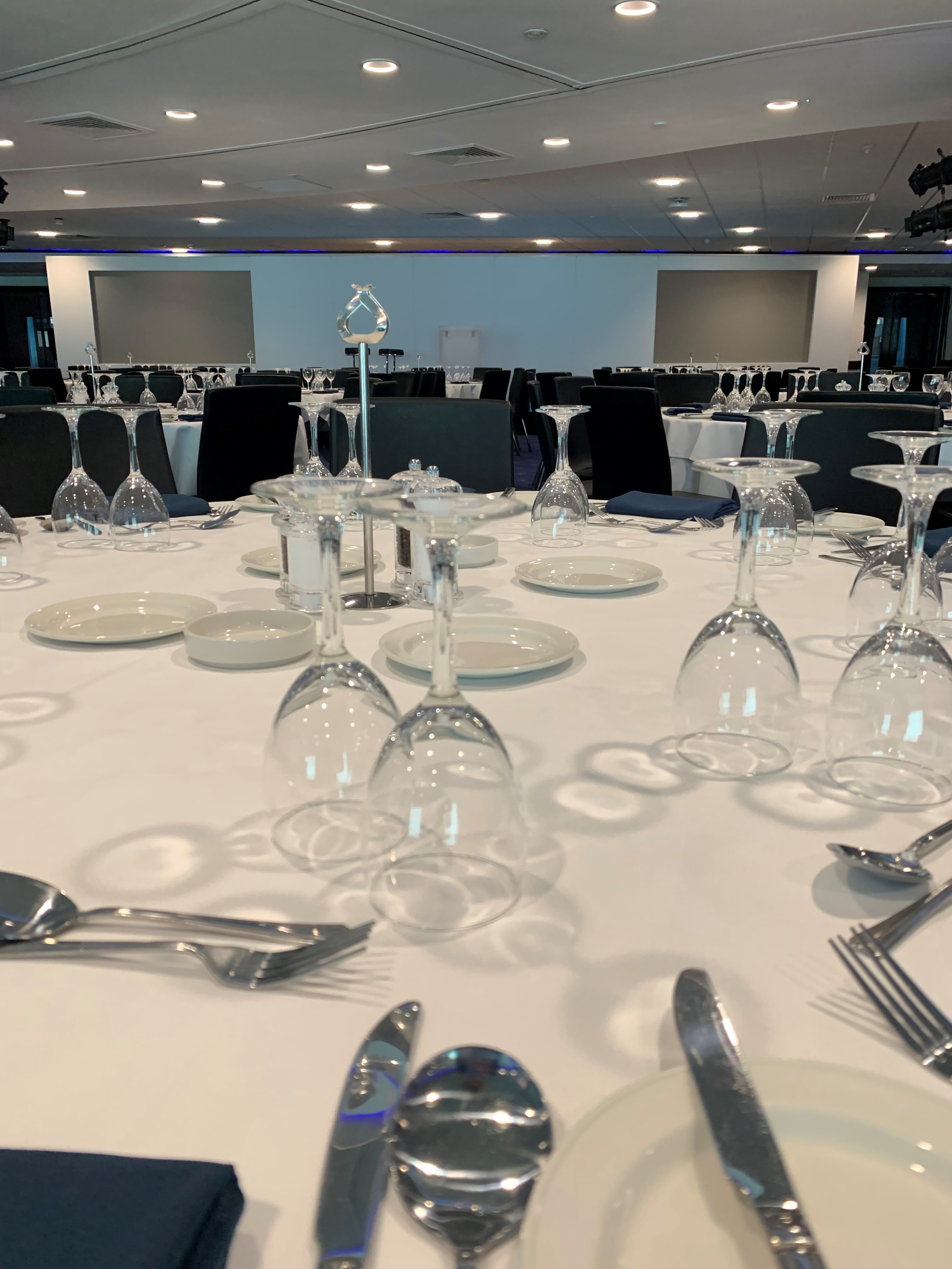 Elegant dining setup in Chelsea FC's Drake and Harris Suites for formal events.