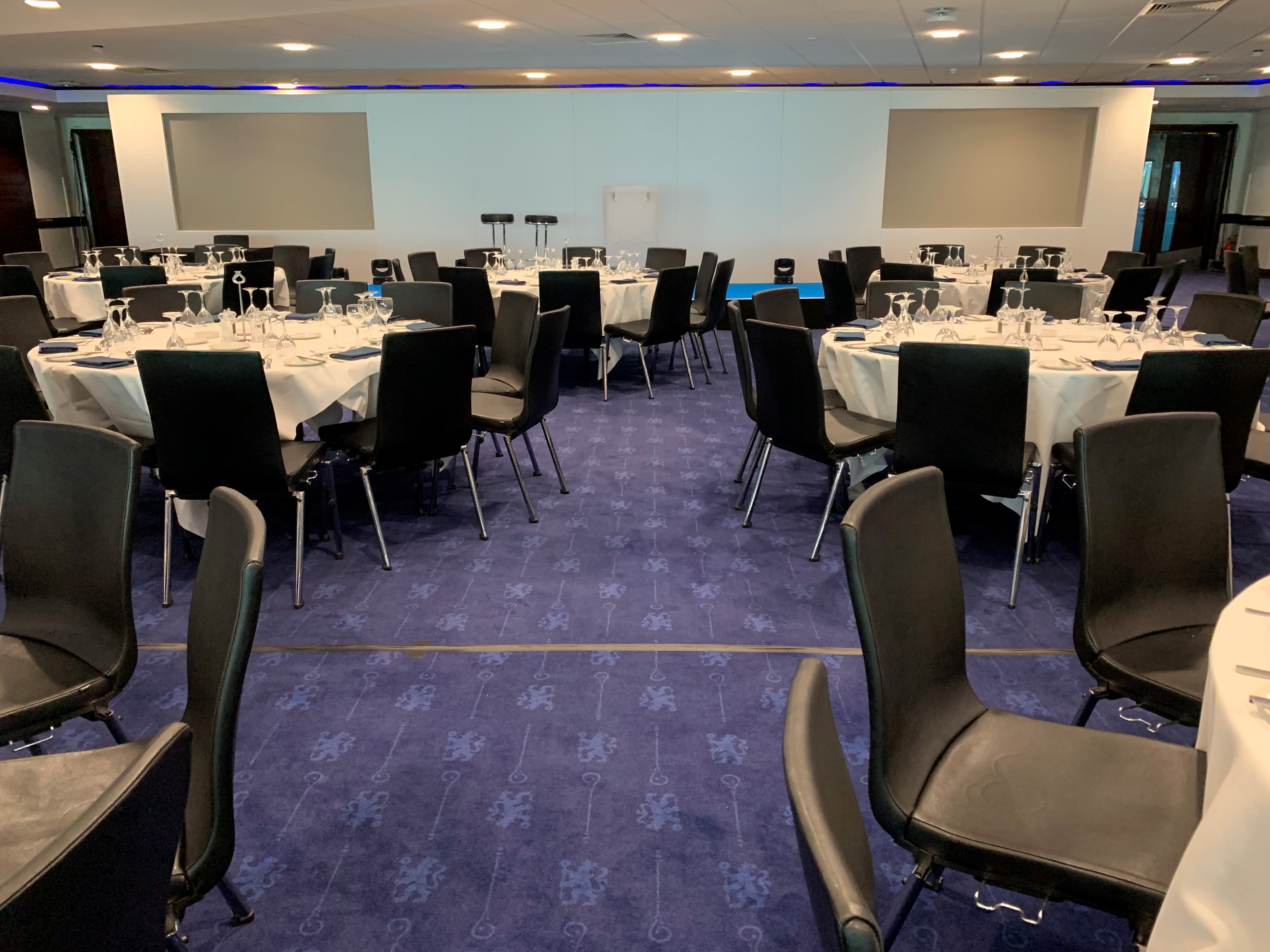 Drake and Harris Suites at Chelsea FC, elegantly set for networking events and dining.