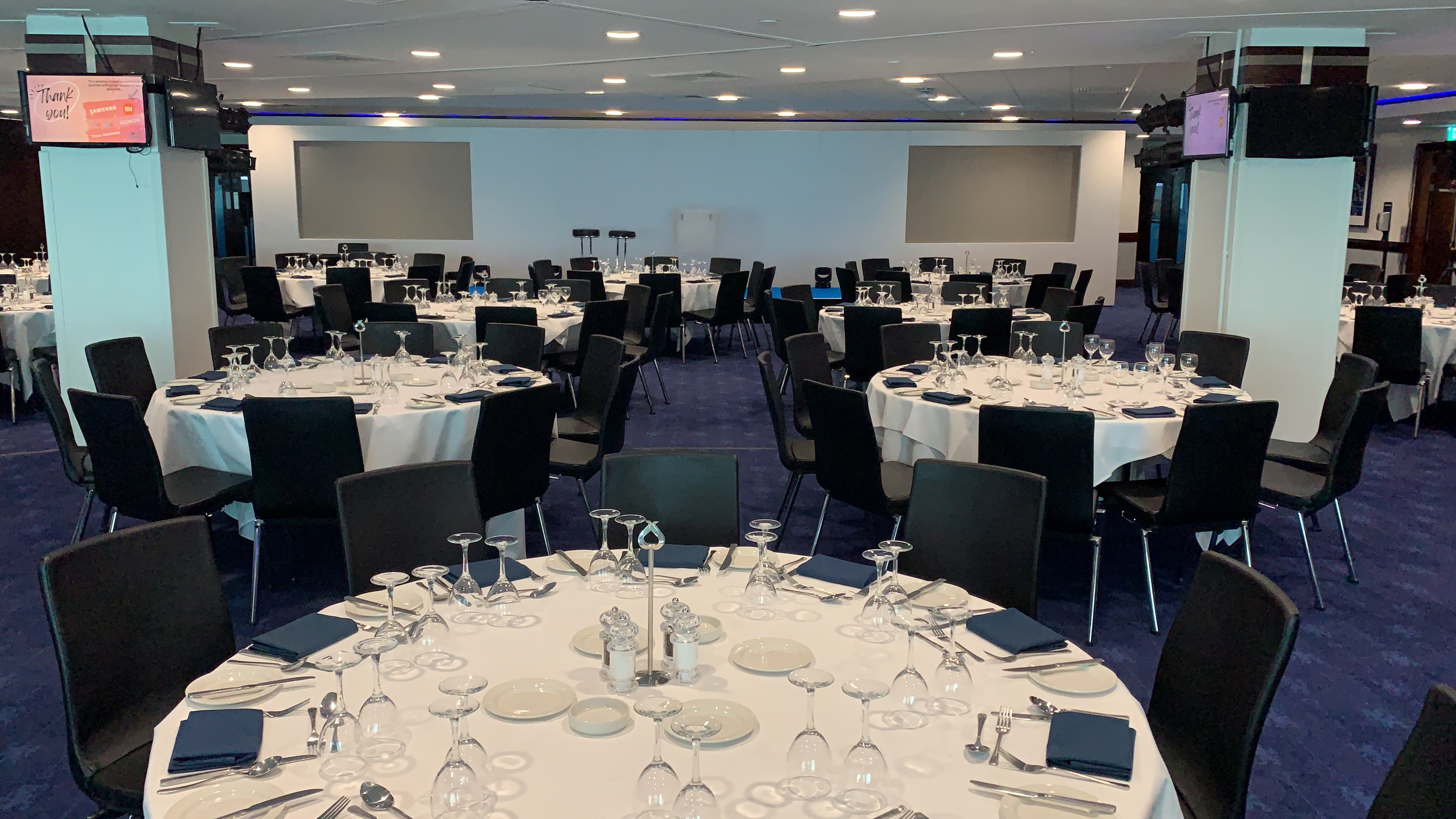 Drake and Harris Suites at Chelsea FC, elegant dinner setup for networking events.