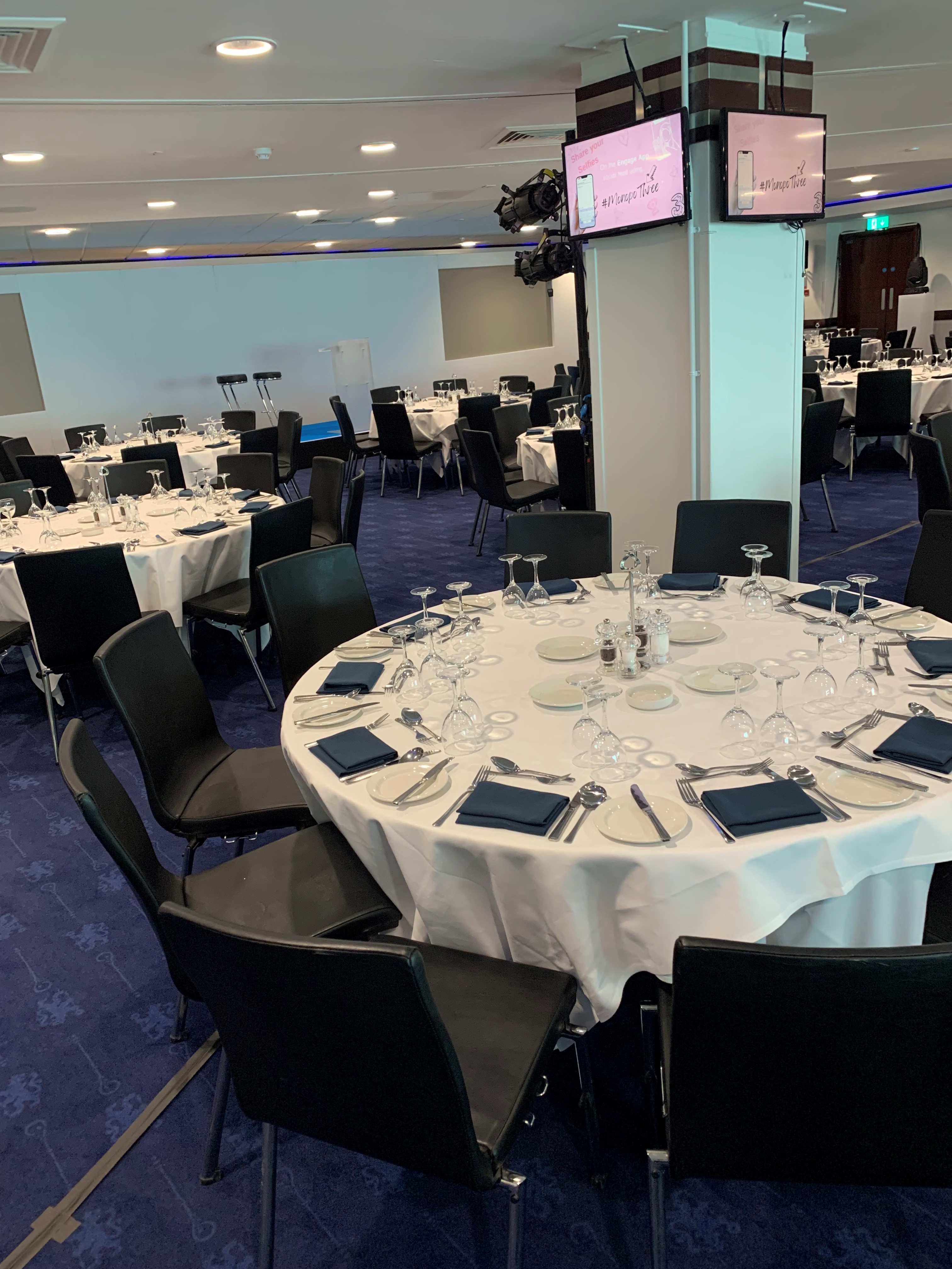 Elegant banquet setup in Chelsea FC's Drake and Harris Suites for corporate events.