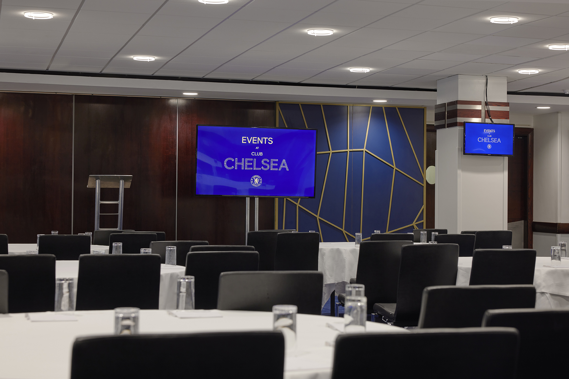 Bonnetti and Clarke Suites at Chelsea FC, ideal corporate meeting space with branding screens.