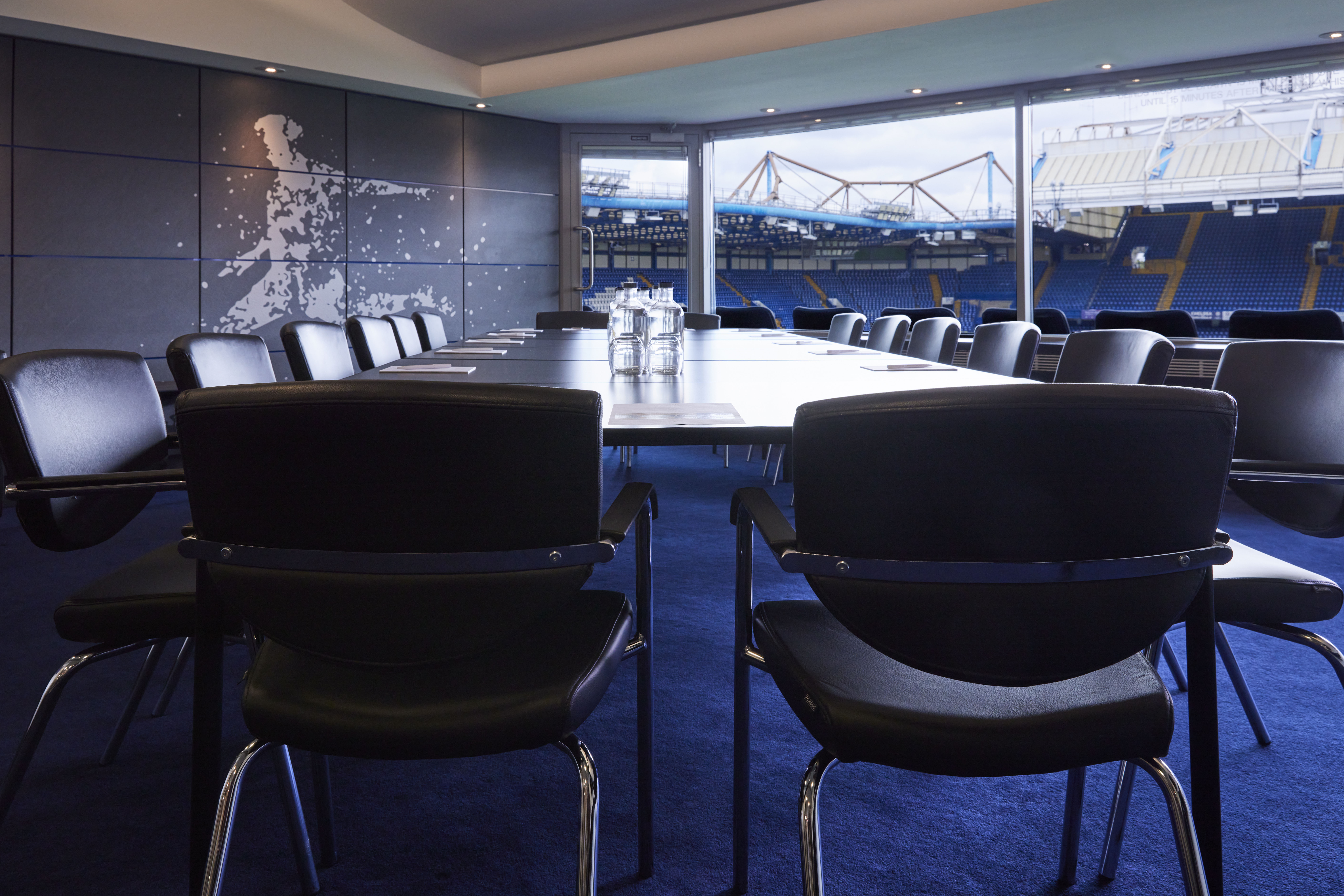 Millennium Suite at Chelsea FC: modern meeting room with stadium view, perfect for corporate events.