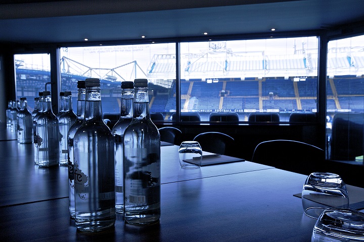 Millennium Suite at Chelsea FC: modern meeting room with stadium view for corporate events.