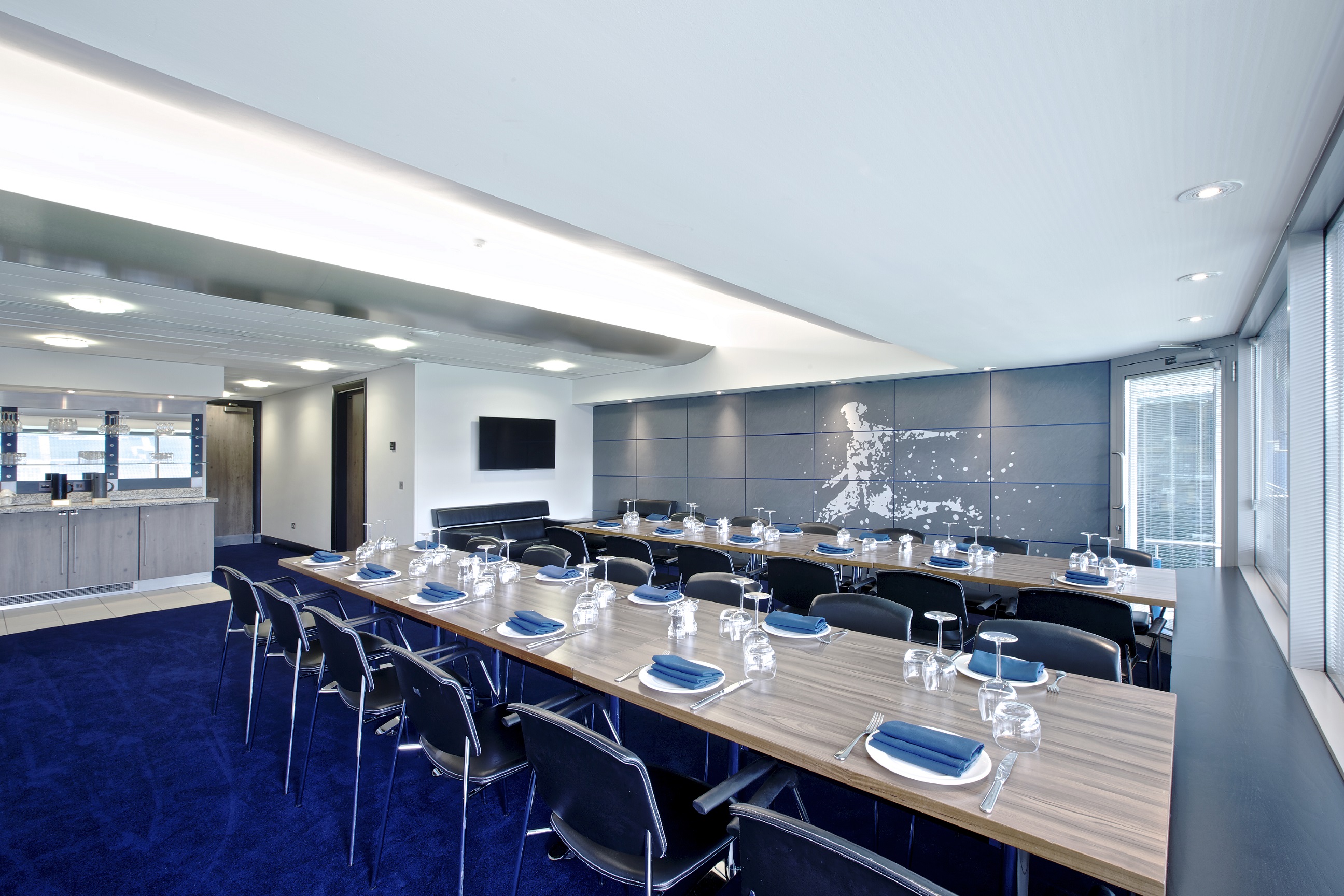 Millennium Suite at Chelsea FC: modern meeting room with elegant decor for professional events.