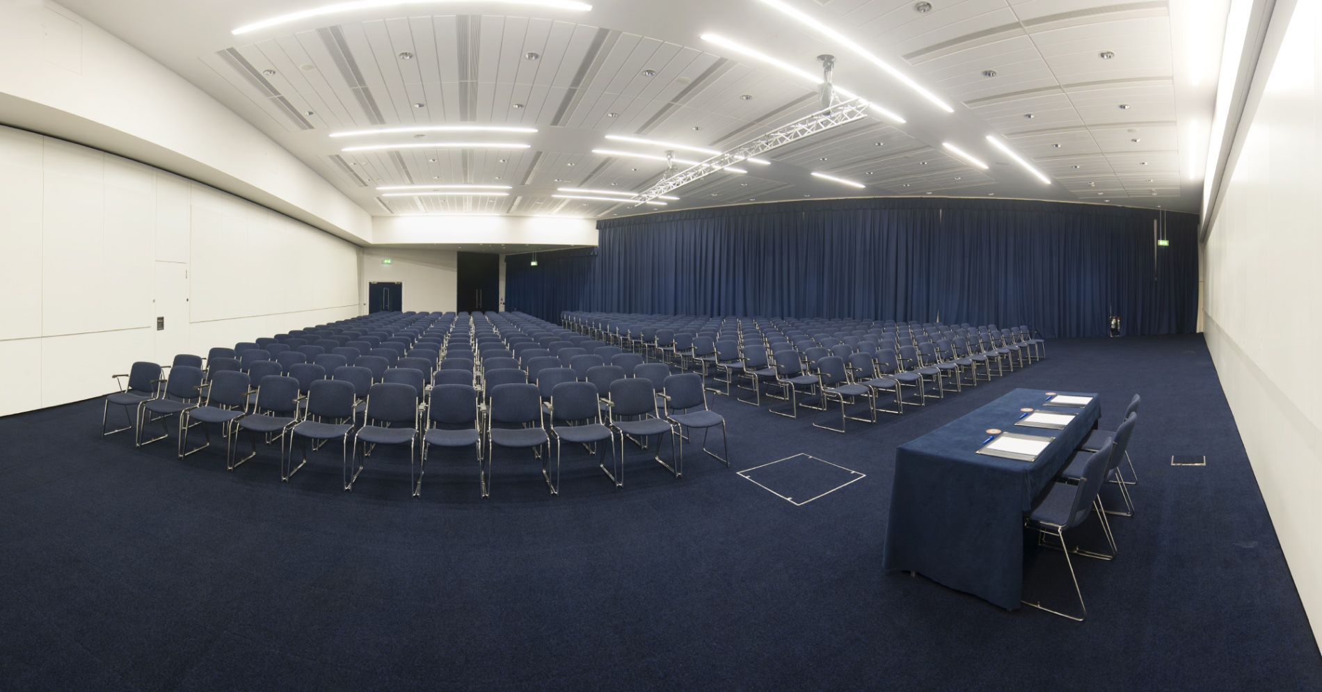 Spacious event venue in Manchester Central set for a large conference with neat seating.