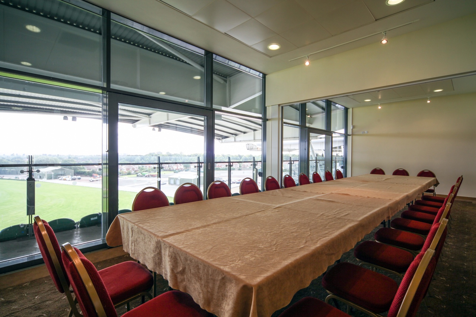 Executive Box at Aintree Racecourse with long table, ideal for corporate meetings and workshops.