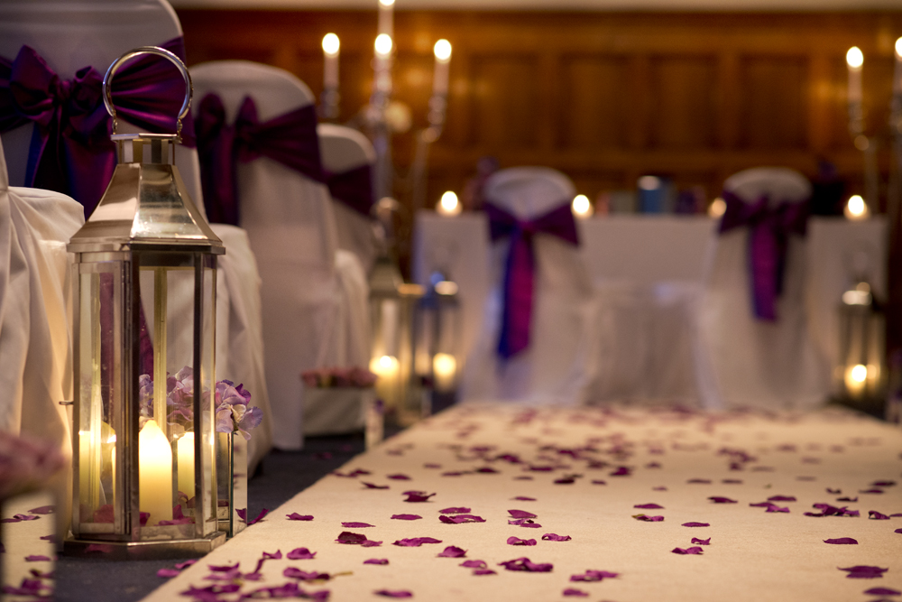 Whitworth Building wedding setup with elegant chairs and romantic ambiance.