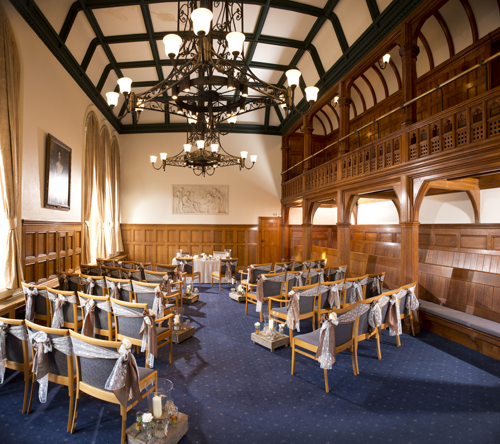 Whitworth Building Council Chamber with elegant wood paneling, ideal for meetings and workshops.