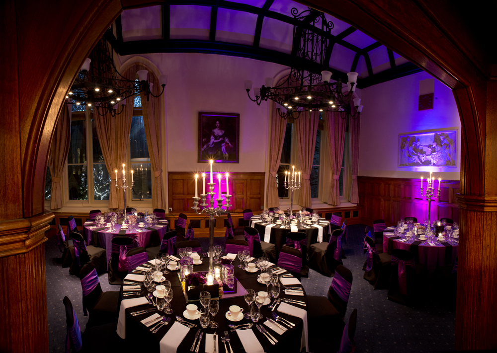 Elegant Whitworth Building banquet hall with purple accents, ideal for weddings and galas.