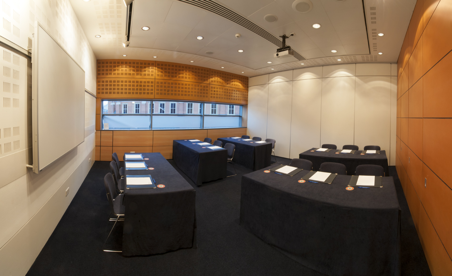 Meeting room in Manchester Central with U-shaped tables for professional gatherings.