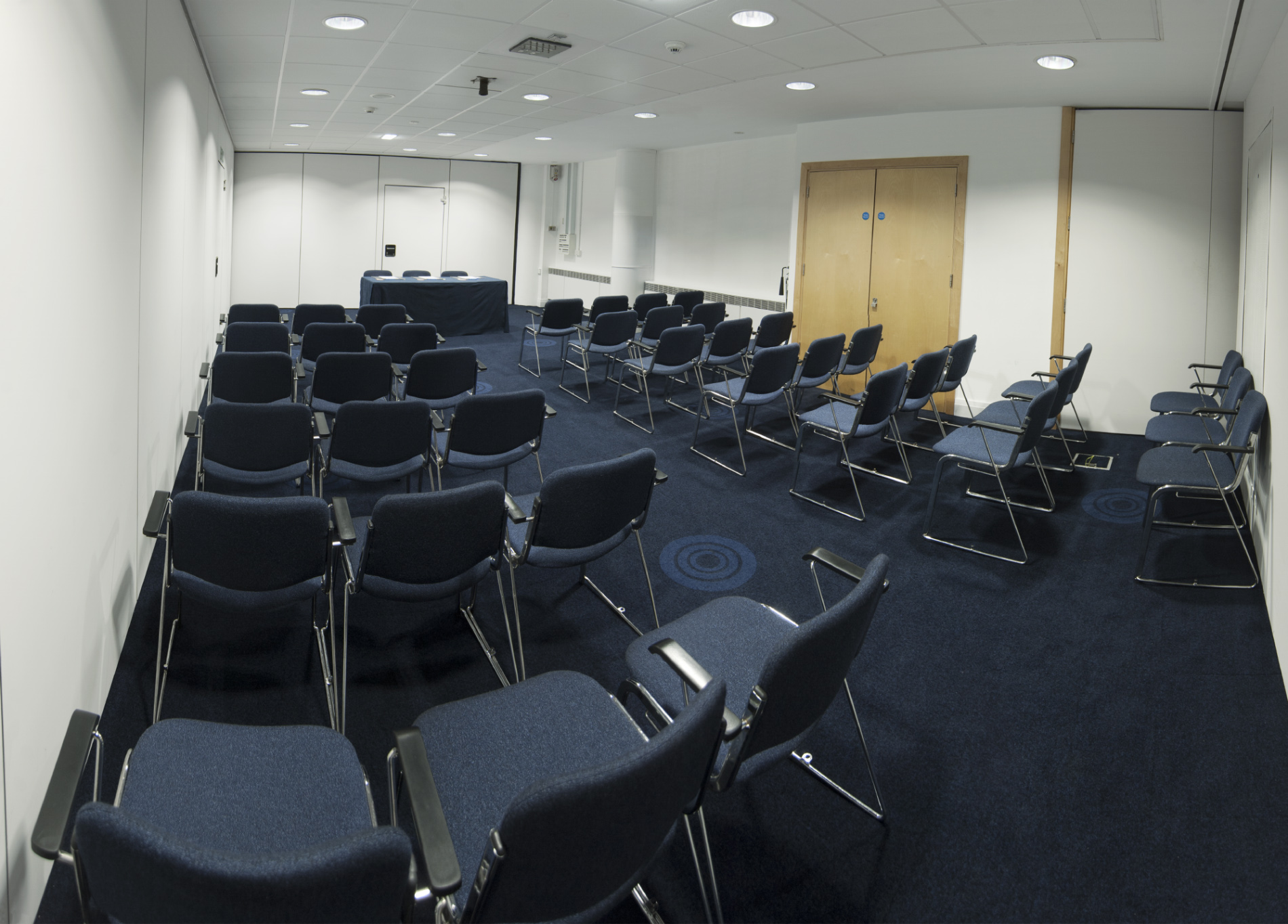 "Exchange Room 8 in Manchester Central, organized for a professional workshop presentation."