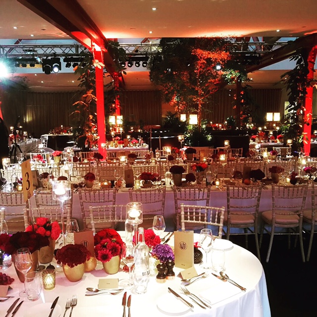 Elegant event space at Bluebird Chelsea with floral centerpieces for galas and formal dinners.