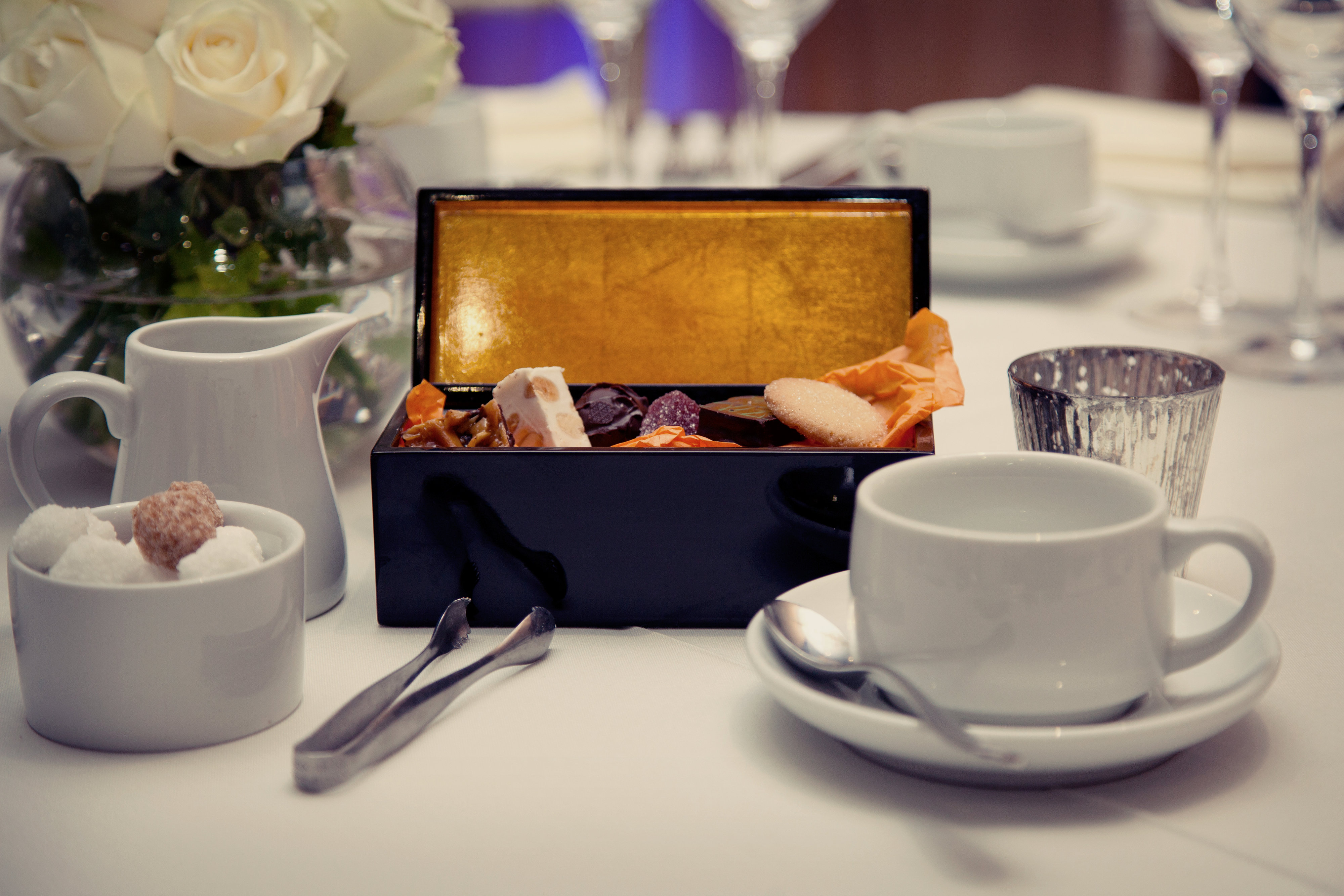 Elegant table setting with dessert box for corporate meetings and upscale events.