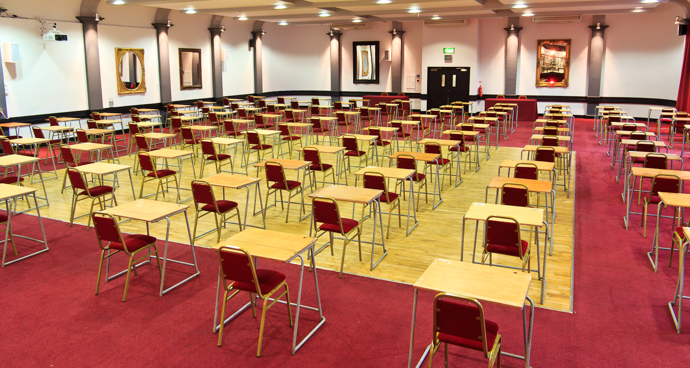 McNamara Suite at The London Irish Centre, spacious meeting room with red chairs.