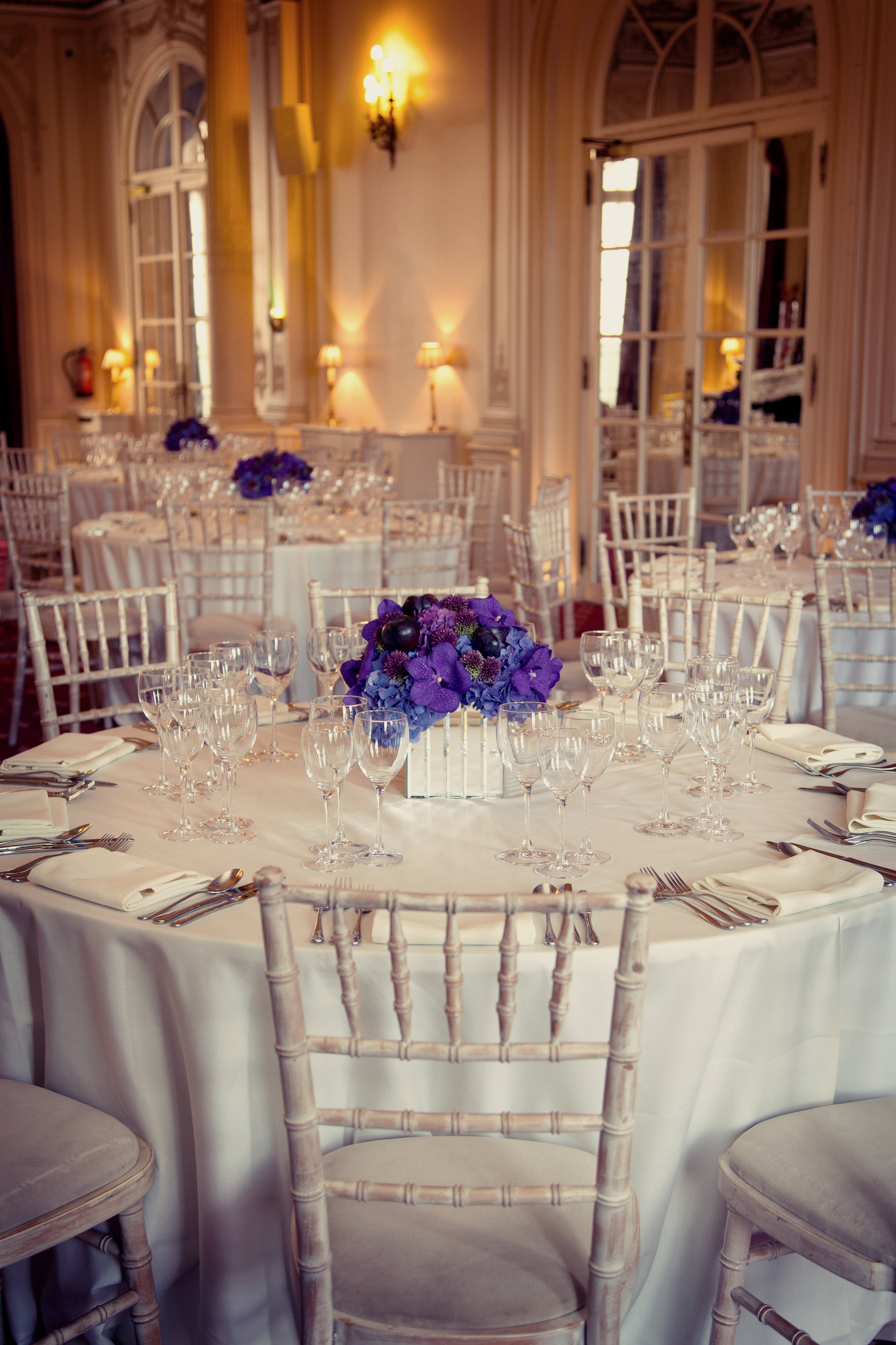 Elegant banquet room with floral centerpieces, ideal for weddings and corporate events.