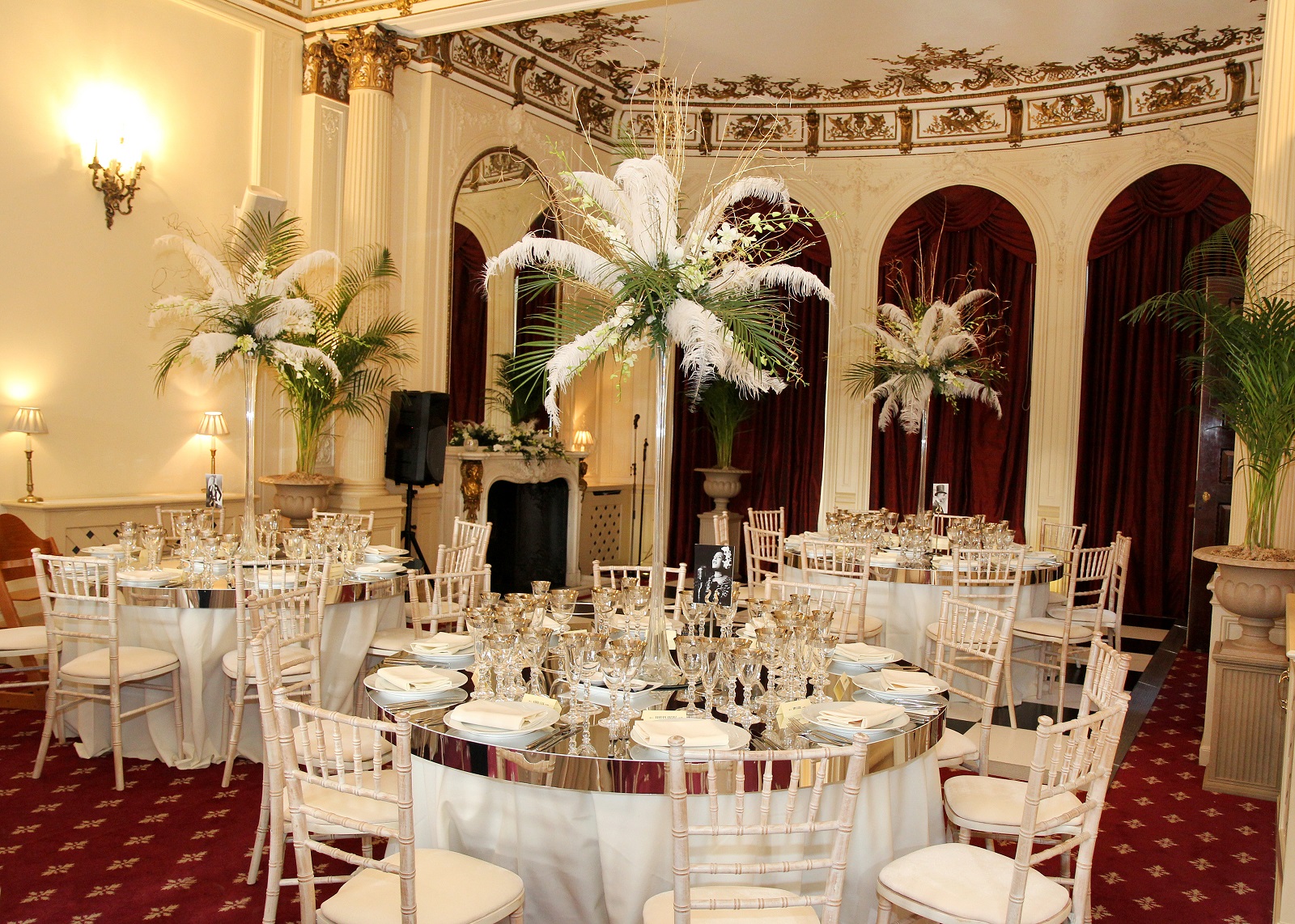 Elegant banquet room with floral centerpieces for weddings and corporate events.