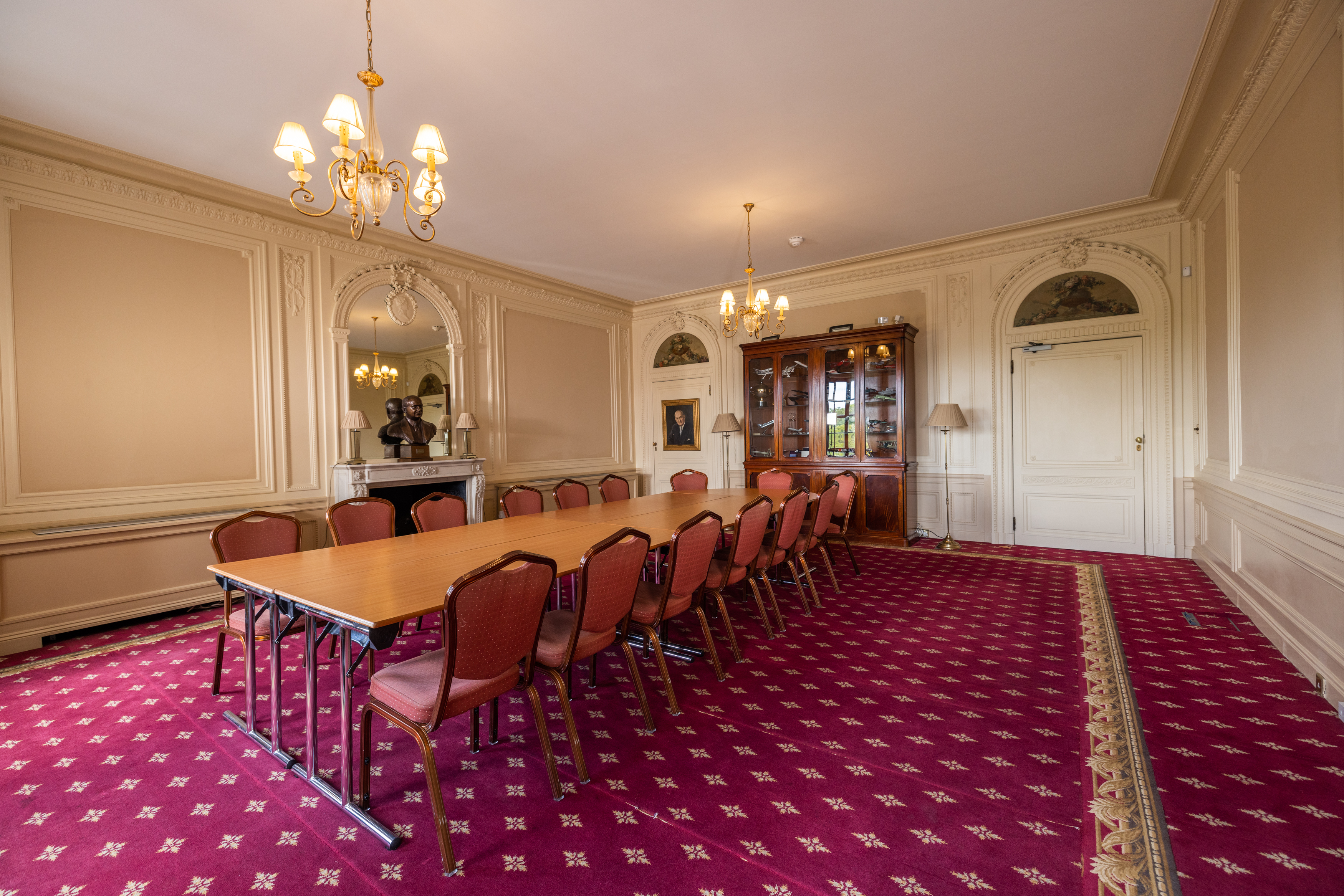 Elegant Handley Page Room with chandeliers, perfect for executive meetings and gatherings.