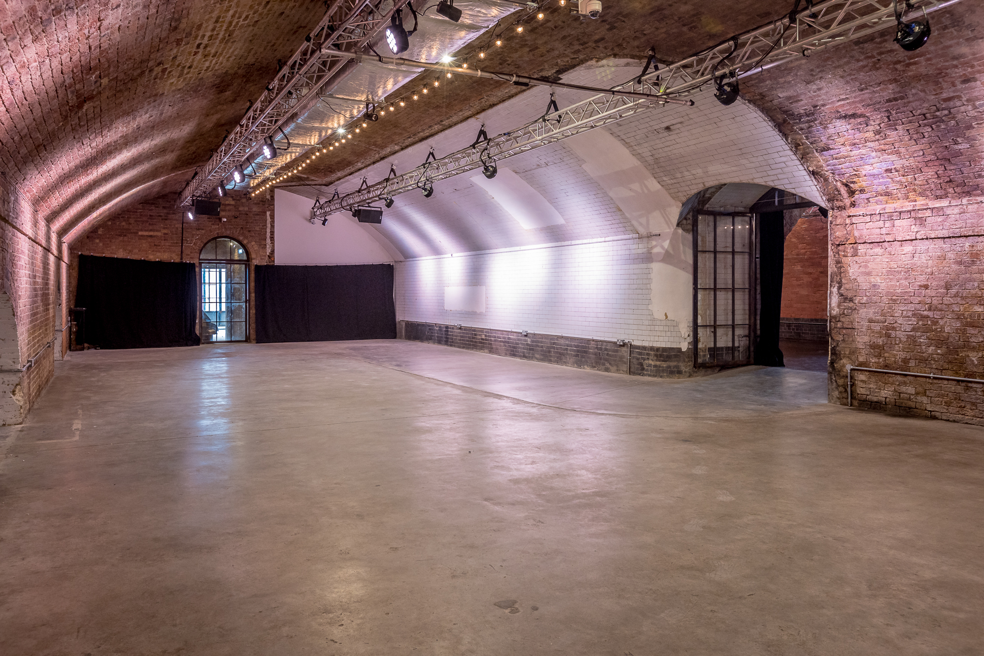 Versatile event space in Kachette Shoreditch with exposed brick walls for corporate and social events.