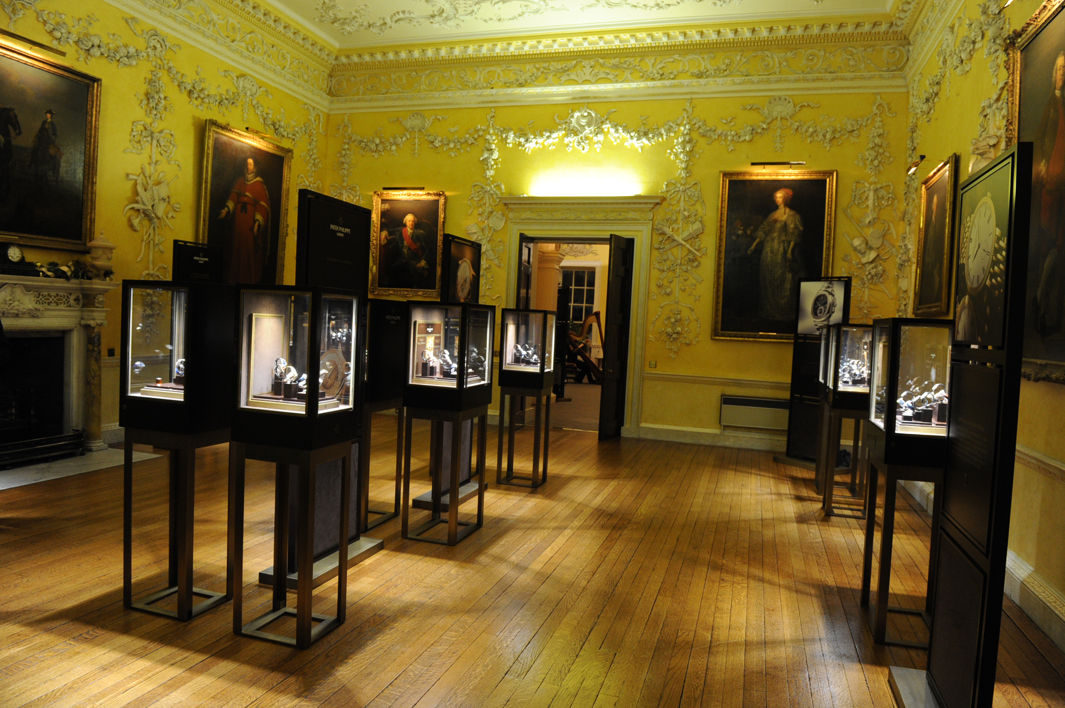 Elegant Saloon at Hagley Hall, featuring display cases for art exhibitions and corporate events.