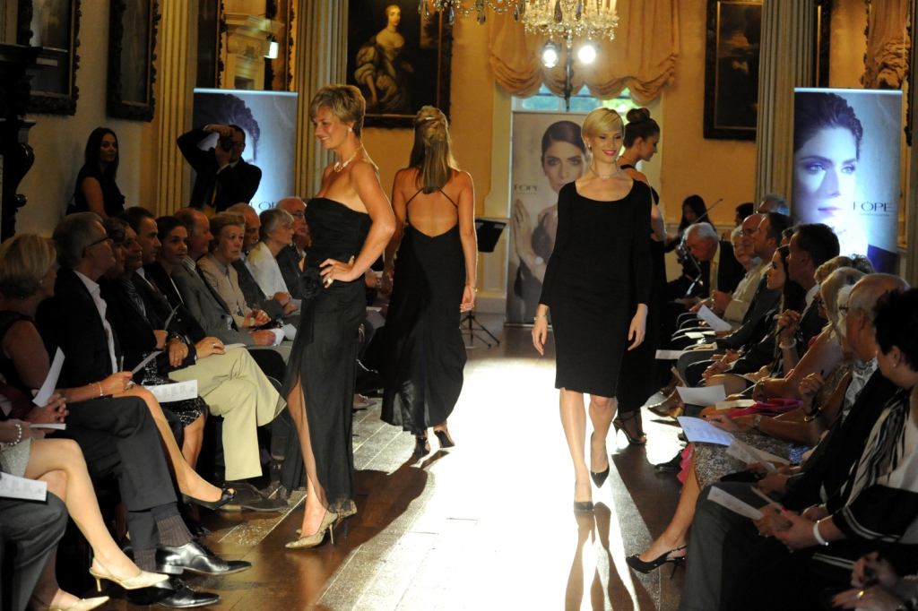 Elegant fashion show at The Saloon, Hagley Hall, showcasing stylish runway design.