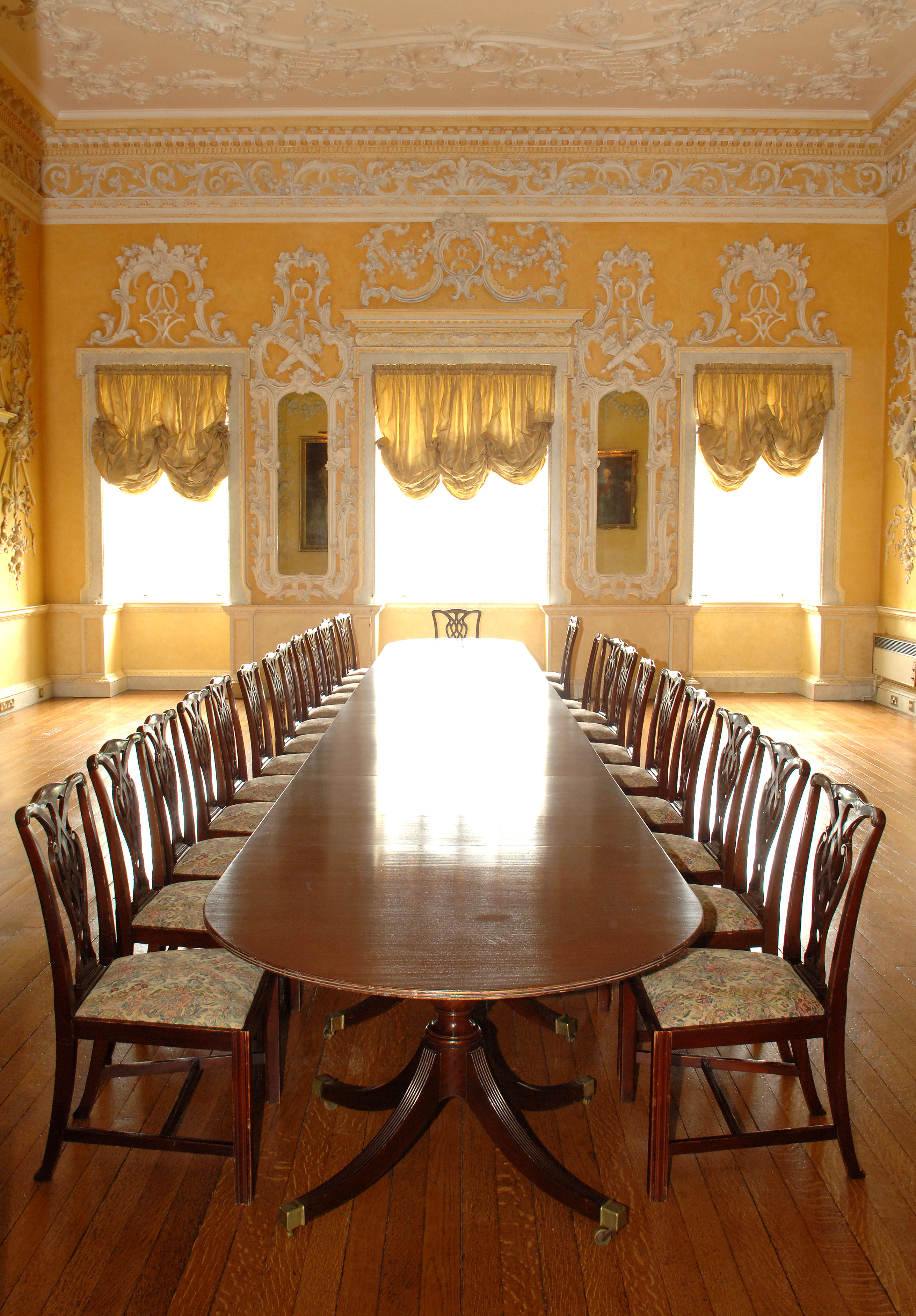 Elegant meeting room at Hagley Hall with polished table, ideal for formal events.