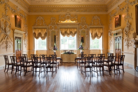 Elegant Saloon at Hagley Hall for meetings and seminars with wooden flooring and floral accents.