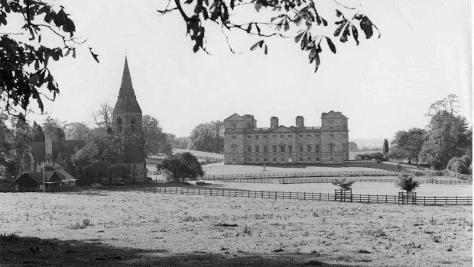 Elegant Saloon at Hagley Hall with church spire, perfect for weddings and retreats.
