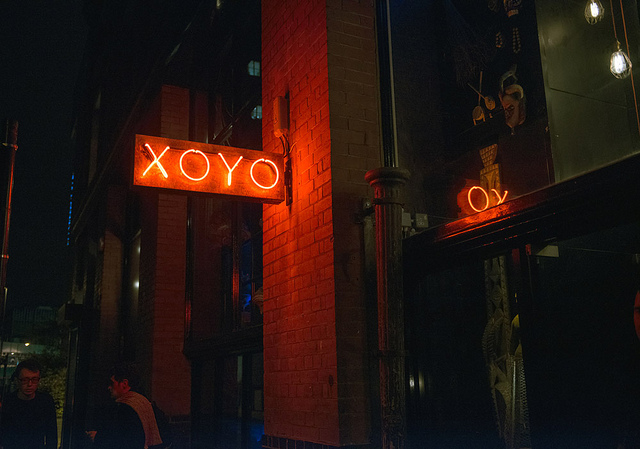 Vibrant XOYO MAIN SPACE with neon lights, perfect for nightlife events and gatherings.