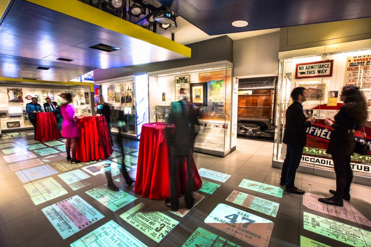 London Transport Museum event space with interactive projections and vibrant decor.