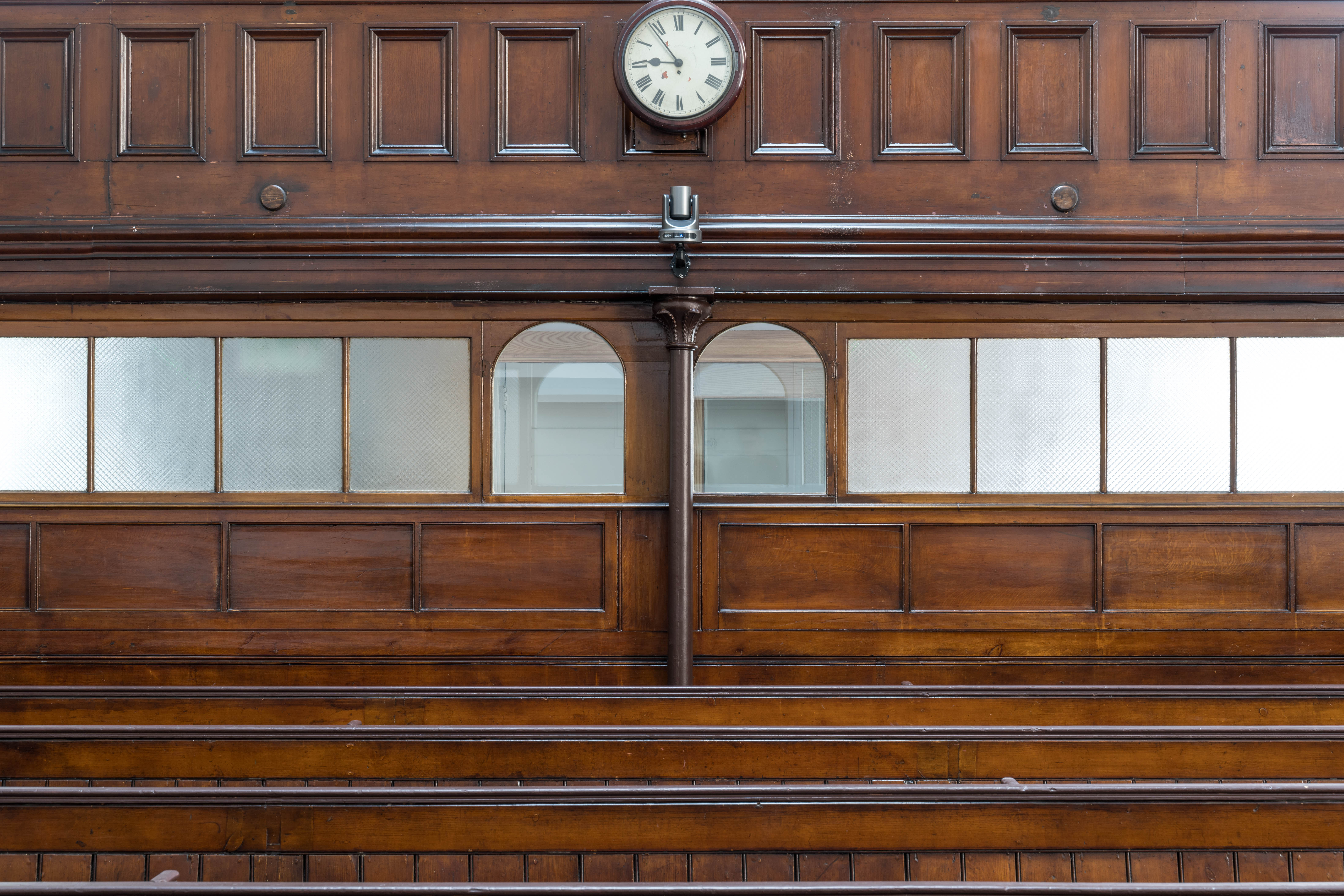 Main Hall in Newington Green Meeting House with wooden paneling, ideal for workshops and gatherings.