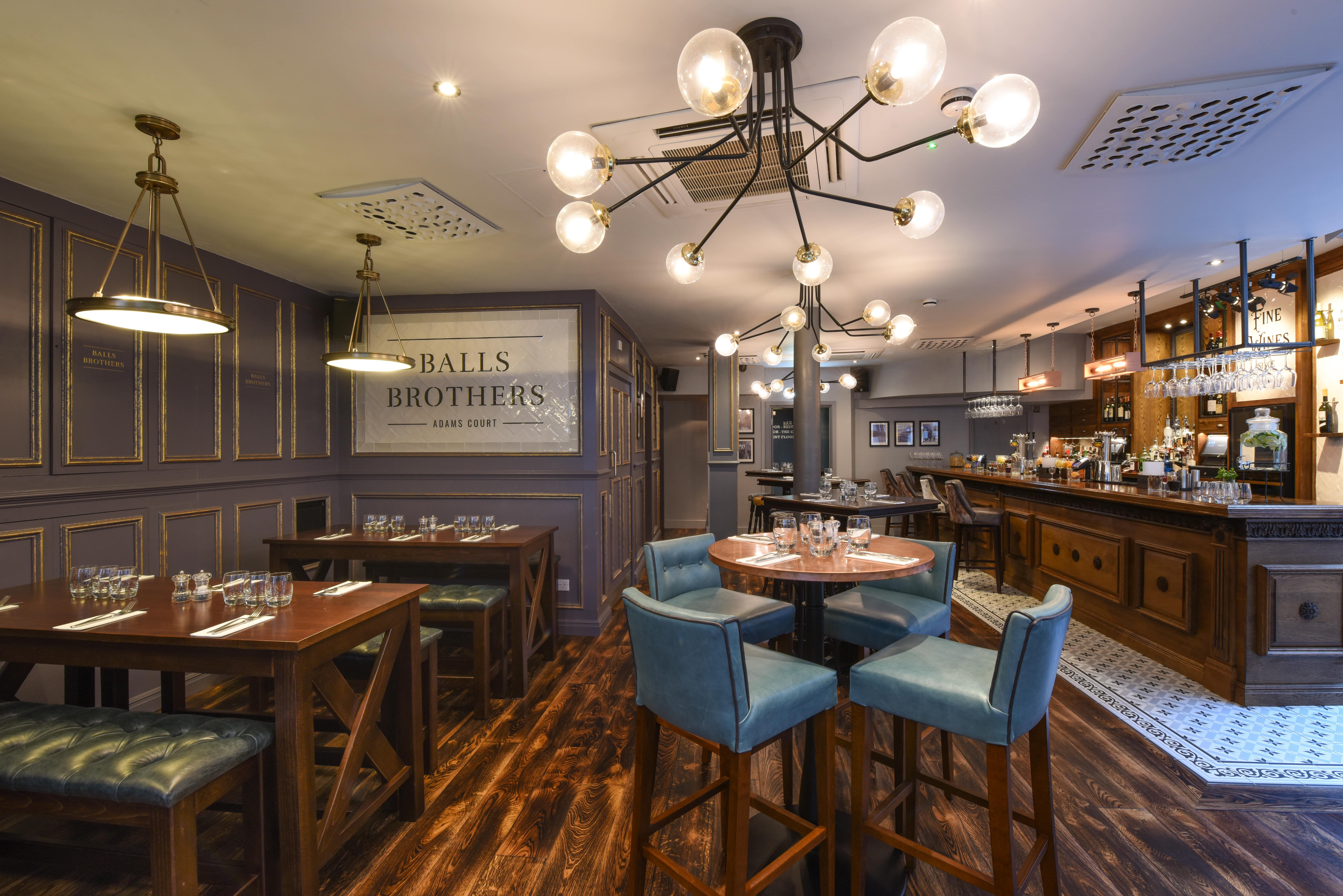 Stylish event space in Jamie’s Adams Court with modern decor for networking or dining.