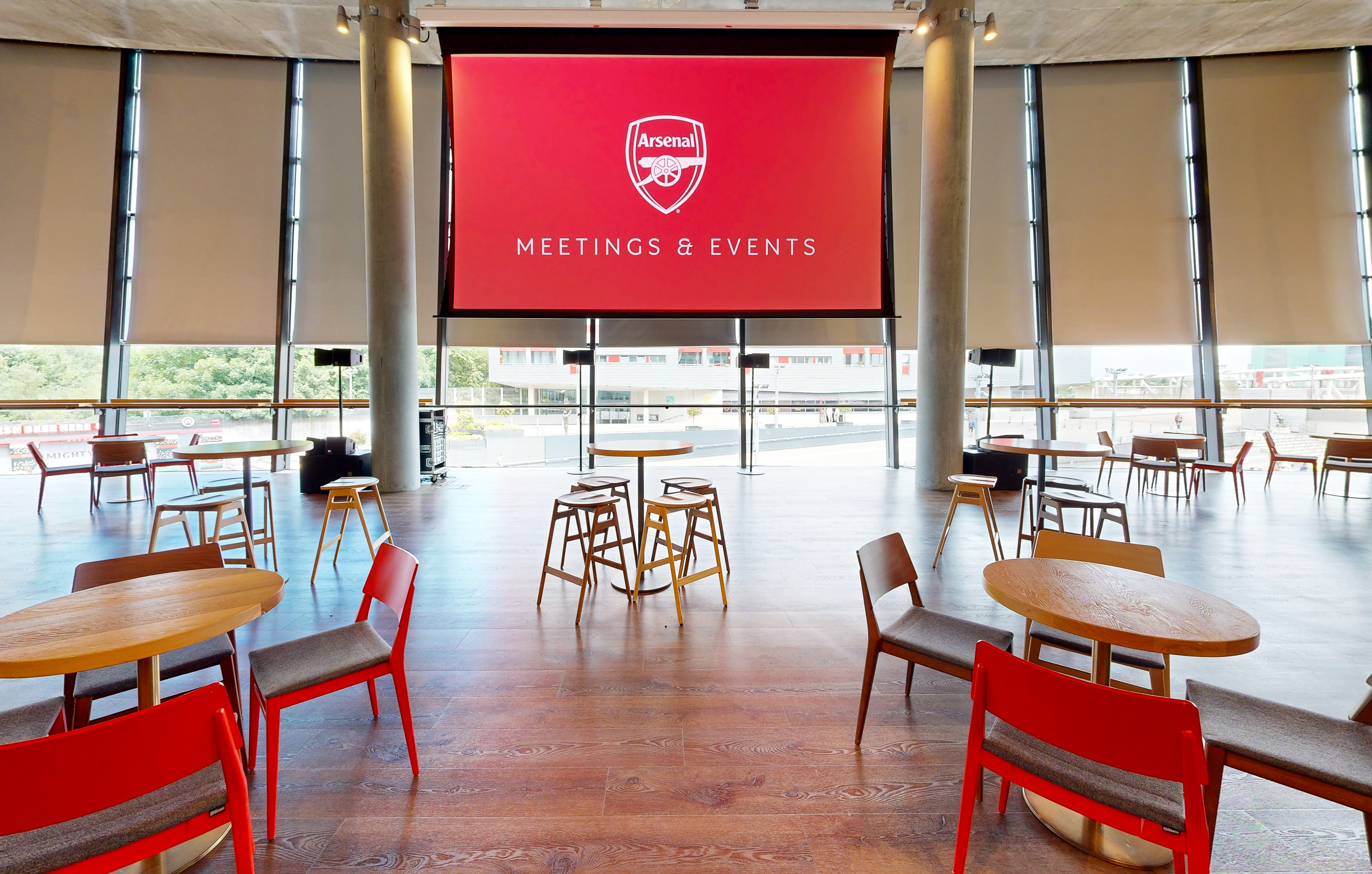 Royal Oak event space at Emirates Stadium with large screen for meetings and gatherings.
