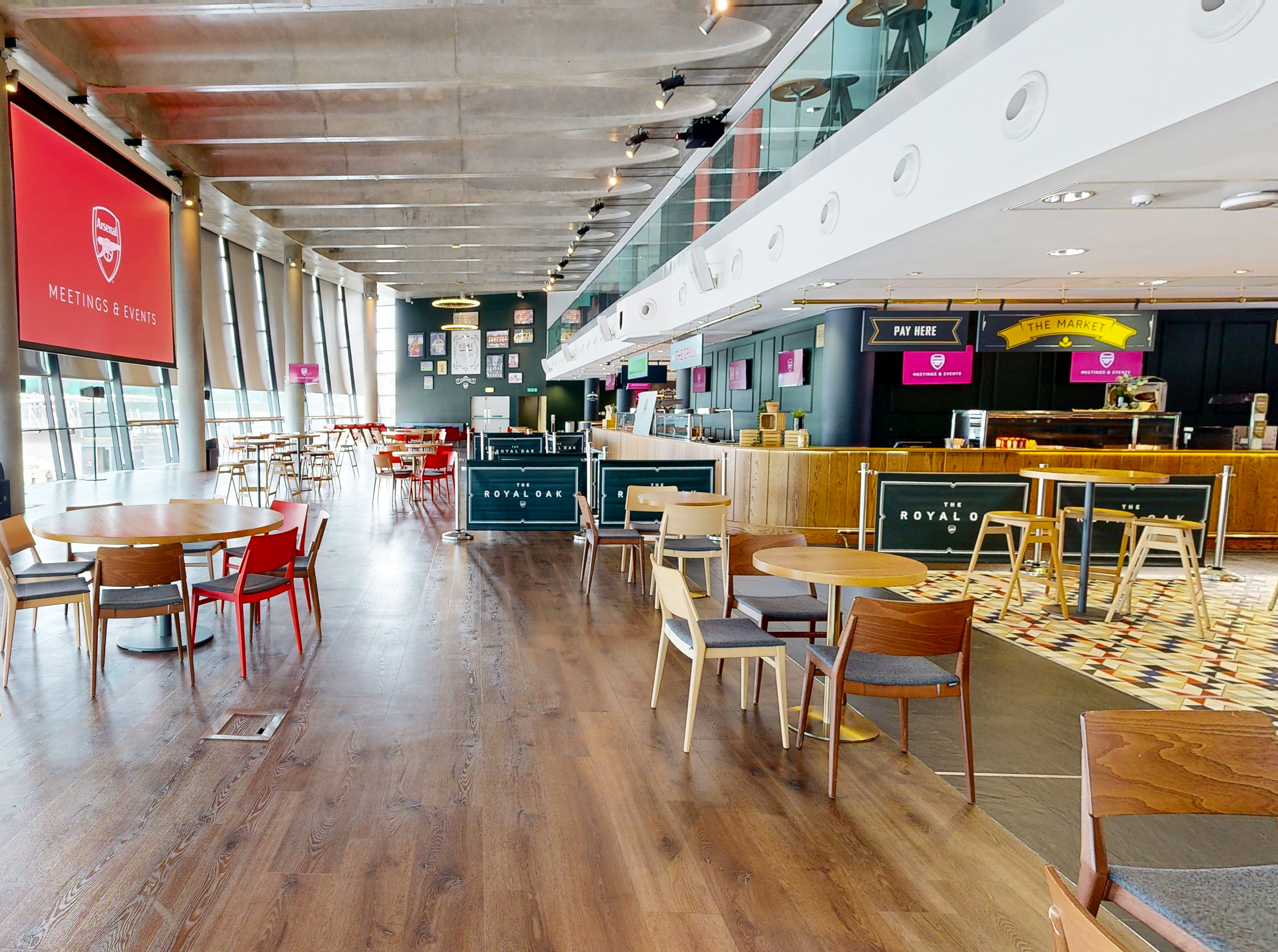 Royal Oak event space at Emirates Stadium with vibrant decor for meetings and gatherings.