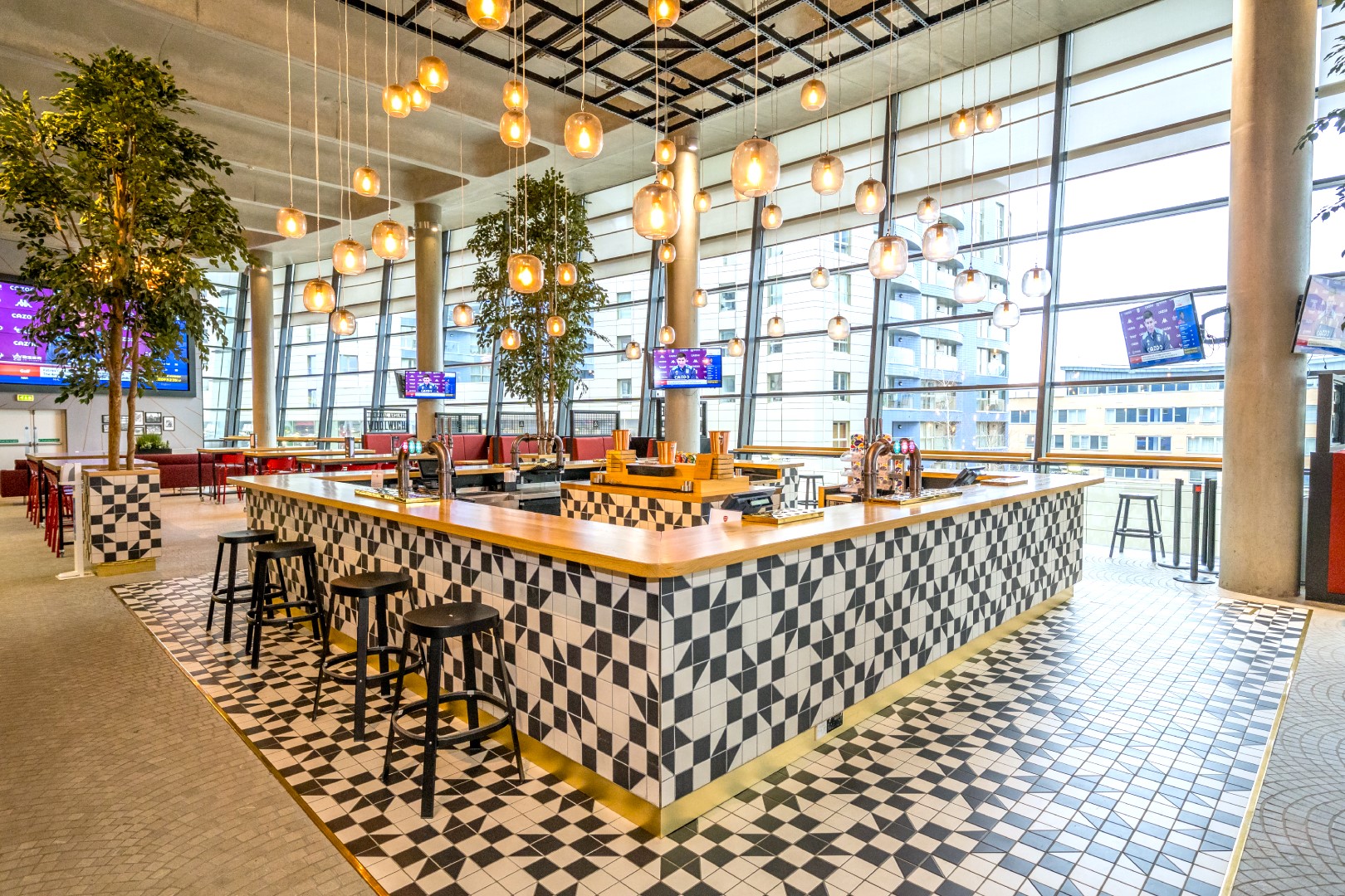 Stylish bar area at Emirates Stadium, ideal for networking events and social gatherings.