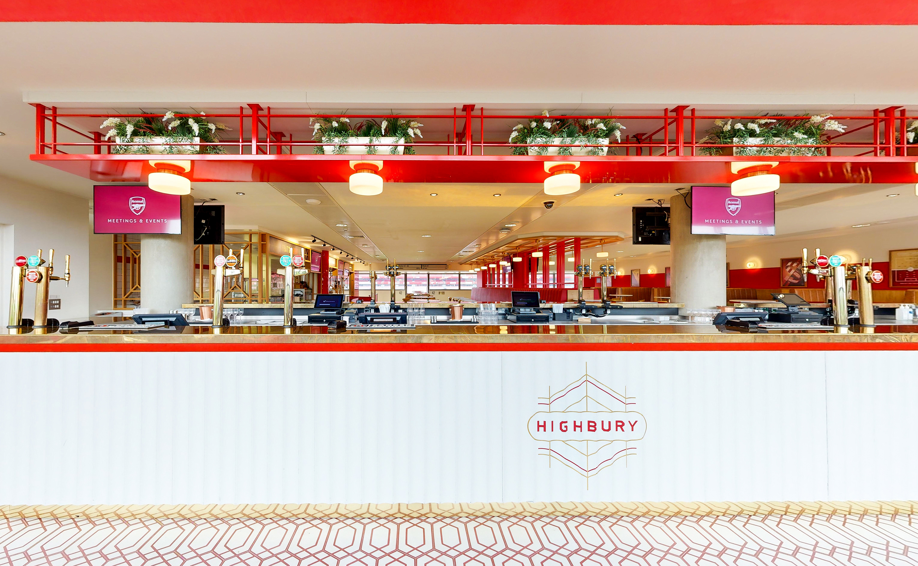Highbury event space at Emirates Stadium with sleek bar and vibrant decor for receptions.