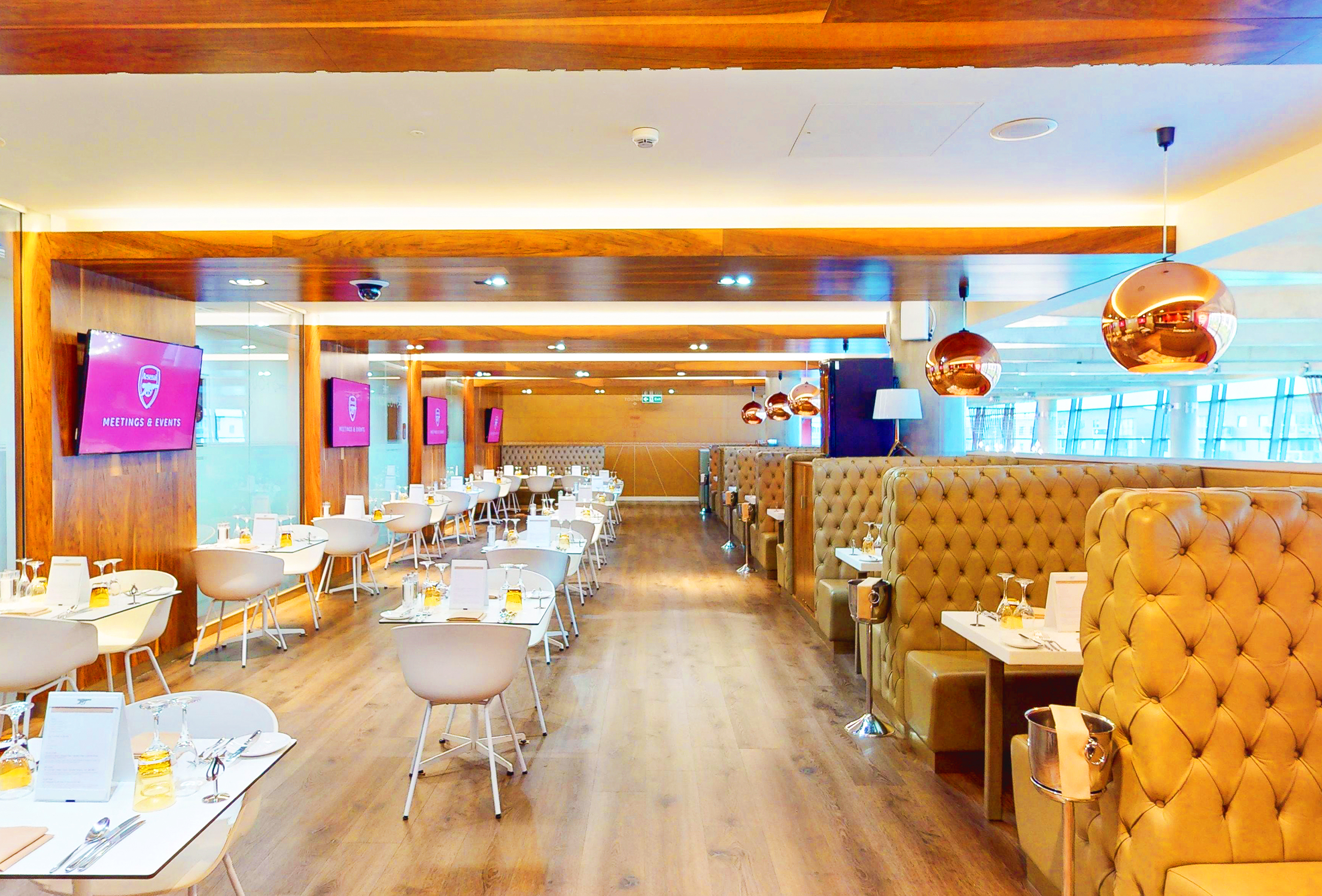 Modern restaurant at Emirates Stadium with elegant lighting for events and meetings.