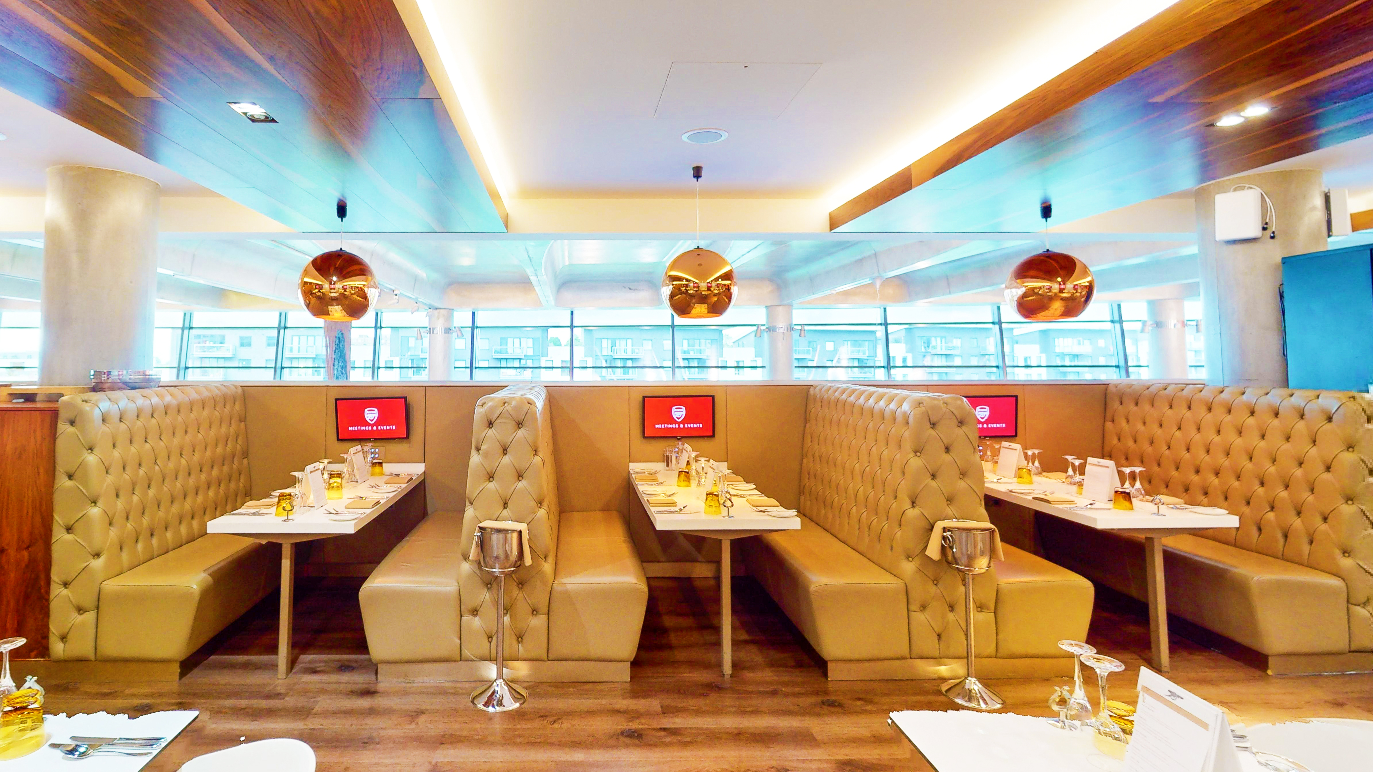Modern dining space at Arsenal's Emirates Stadium, ideal for networking events and meetings.