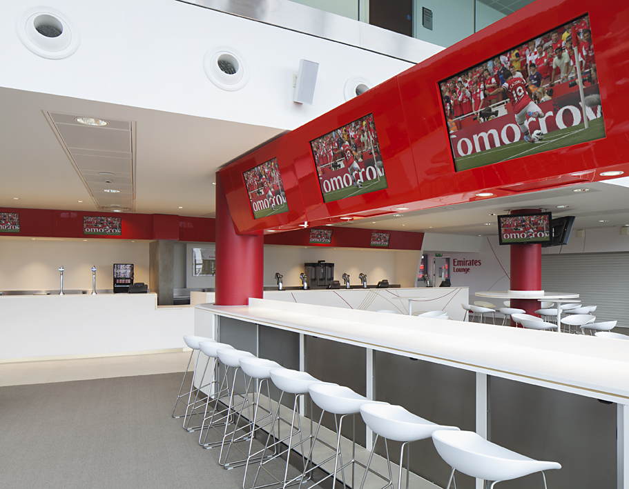 Emirates Lounge at Arsenal FC: modern event space with bar seating for networking events.